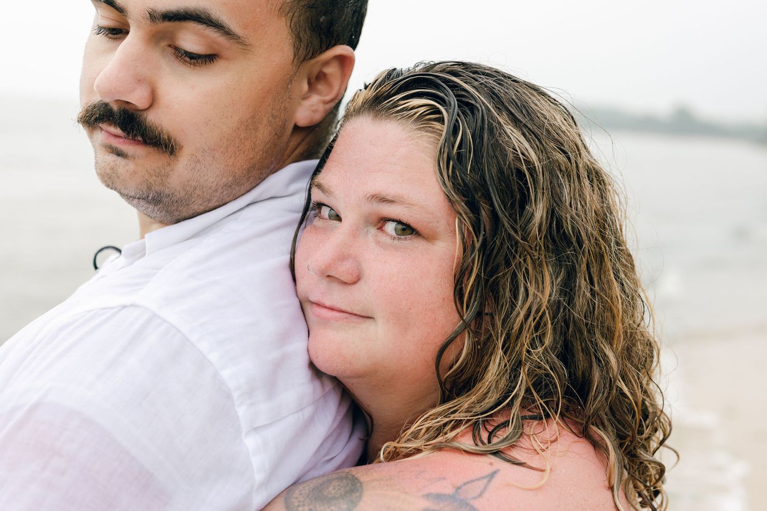 A romantic rainy engagement session at Terrapin Nature Park in Maryland.