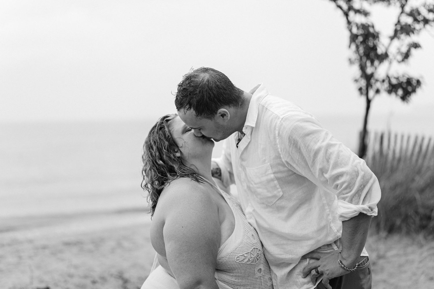 A romantic rainy engagement session at Terrapin Nature Park in Maryland.