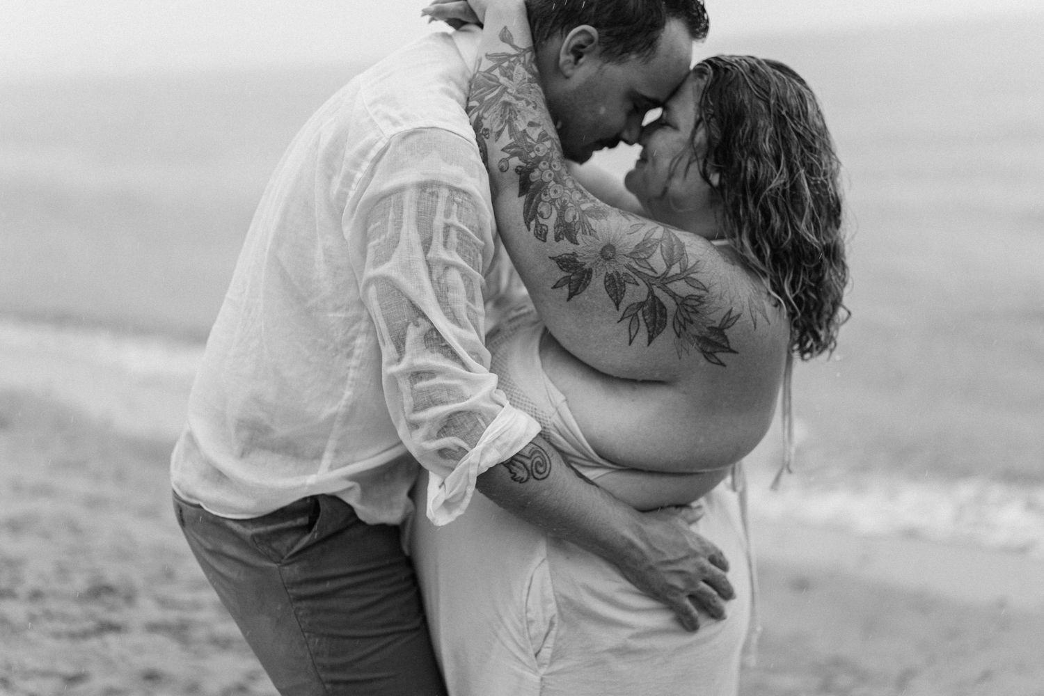A romantic rainy engagement session at Terrapin Nature Park in Maryland.