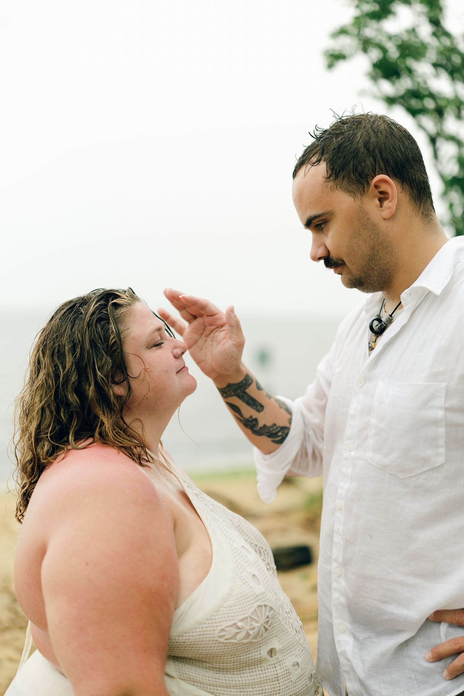A romantic rainy engagement session at Terrapin Nature Park in Maryland.