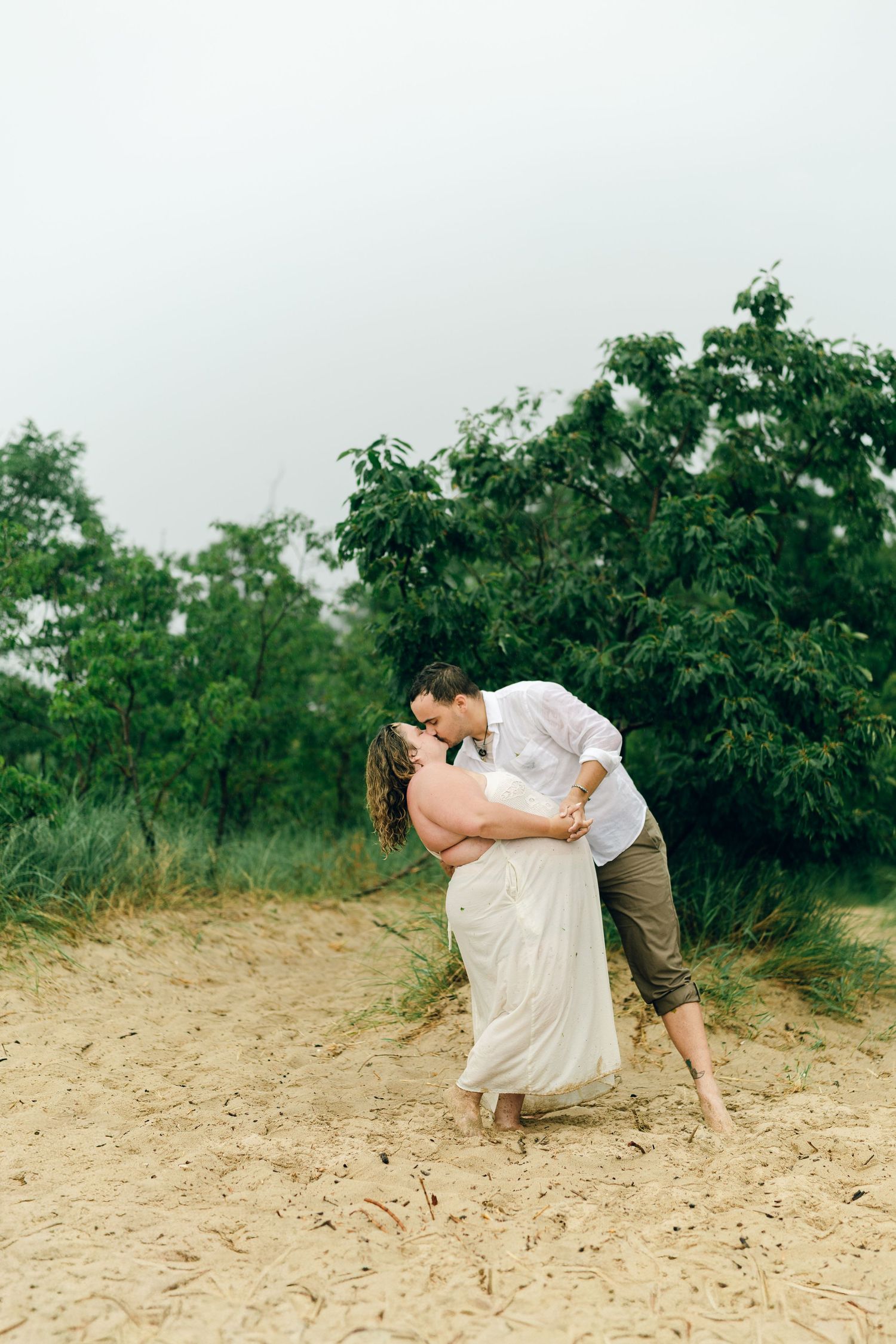 A romantic rainy engagement session at Terrapin Nature Park in Maryland.