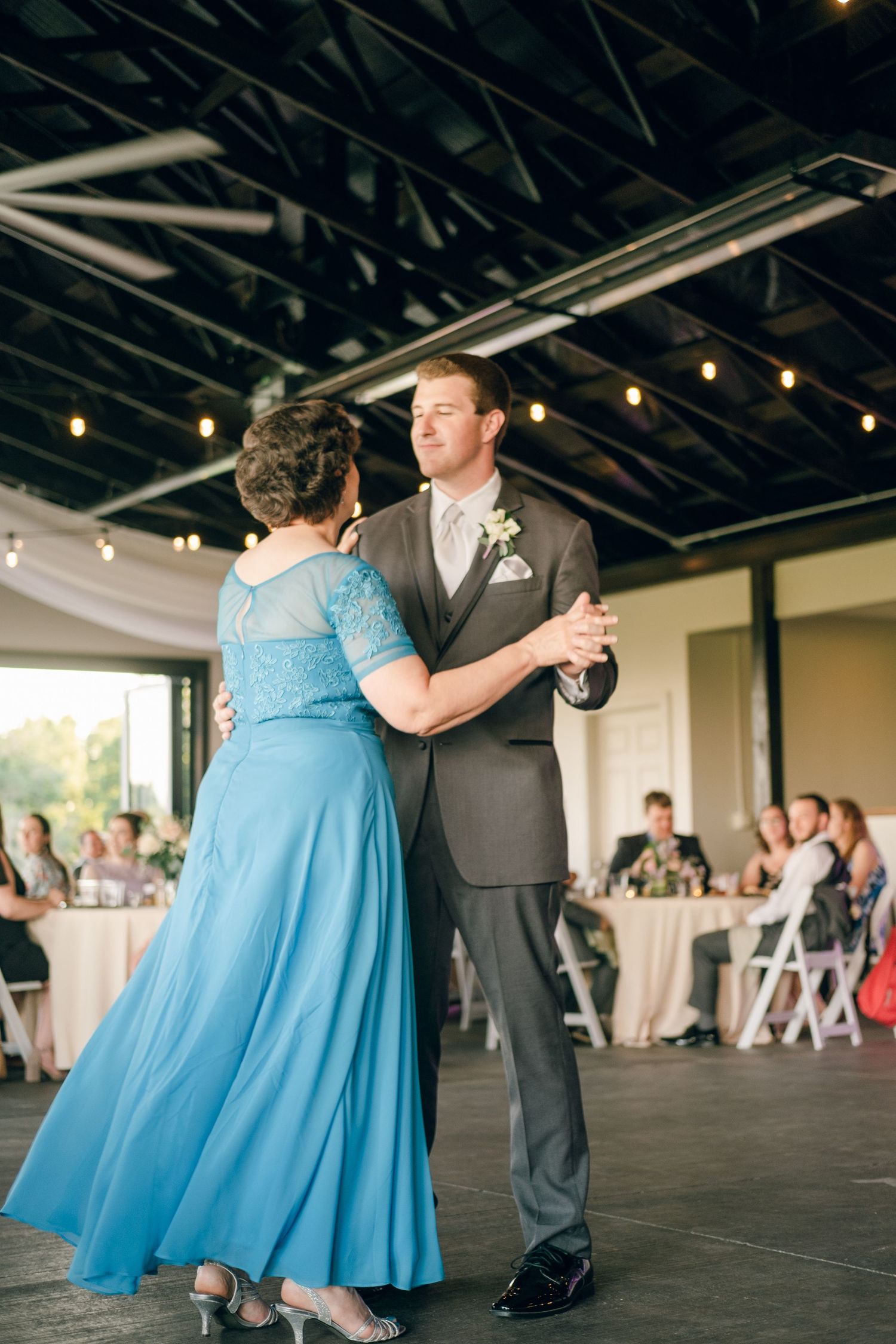 Groom dancing with mother at reception at Chateau Selah wedding in Tennessee.