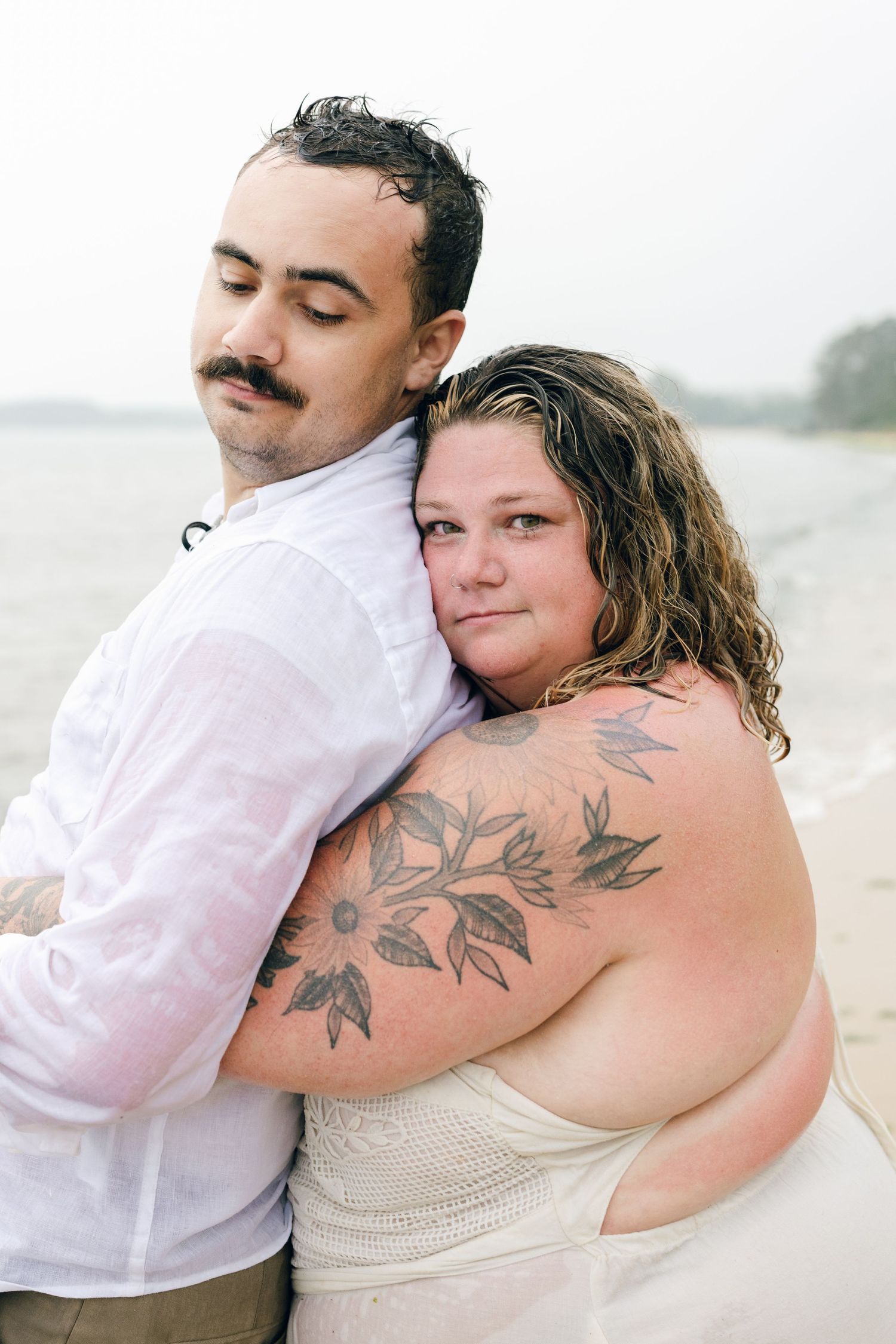 A romantic rainy engagement session at Terrapin Nature Park in Maryland.