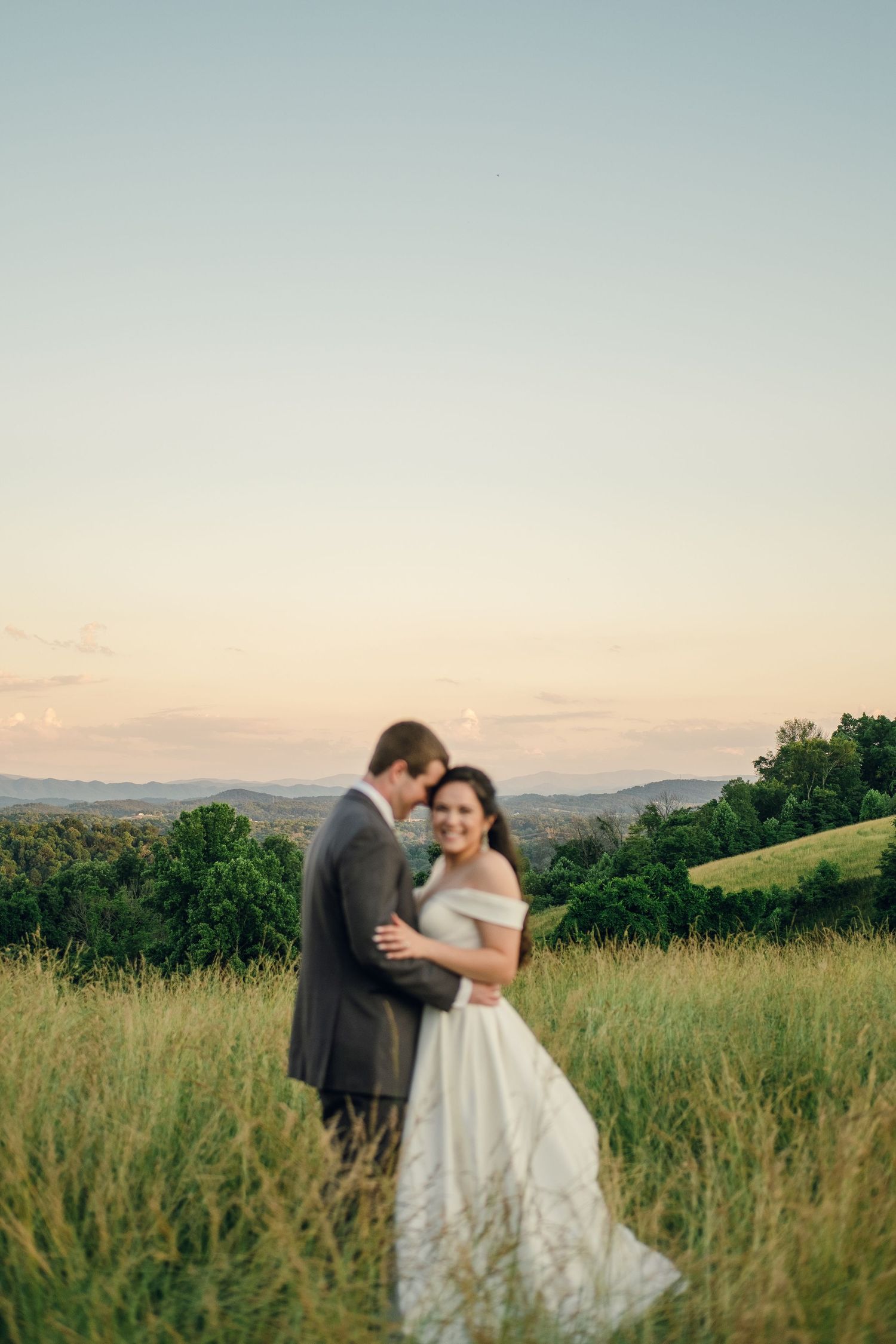 Bride and groom portraits during golden hour in a field at Chateau Selah wedding in Tennessee.
