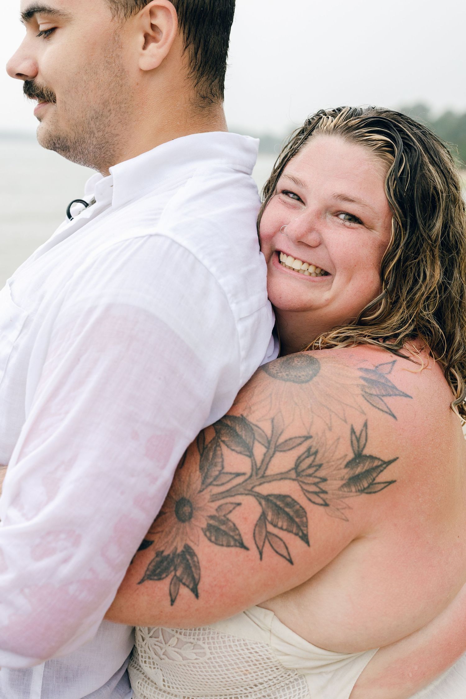 A romantic rainy engagement session at Terrapin Nature Park in Maryland.
