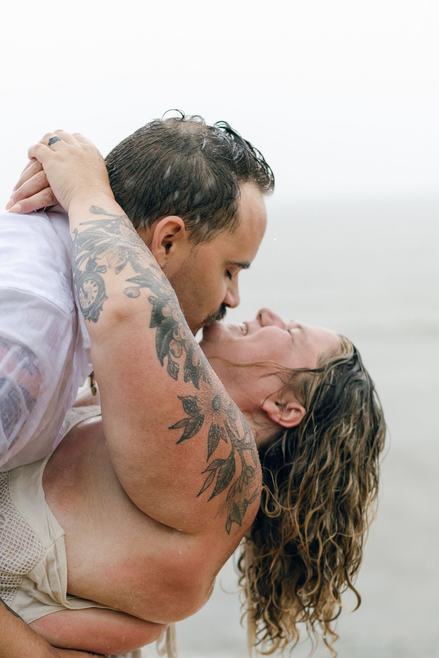 A romantic rainy engagement session at Terrapin Nature Park in Maryland.