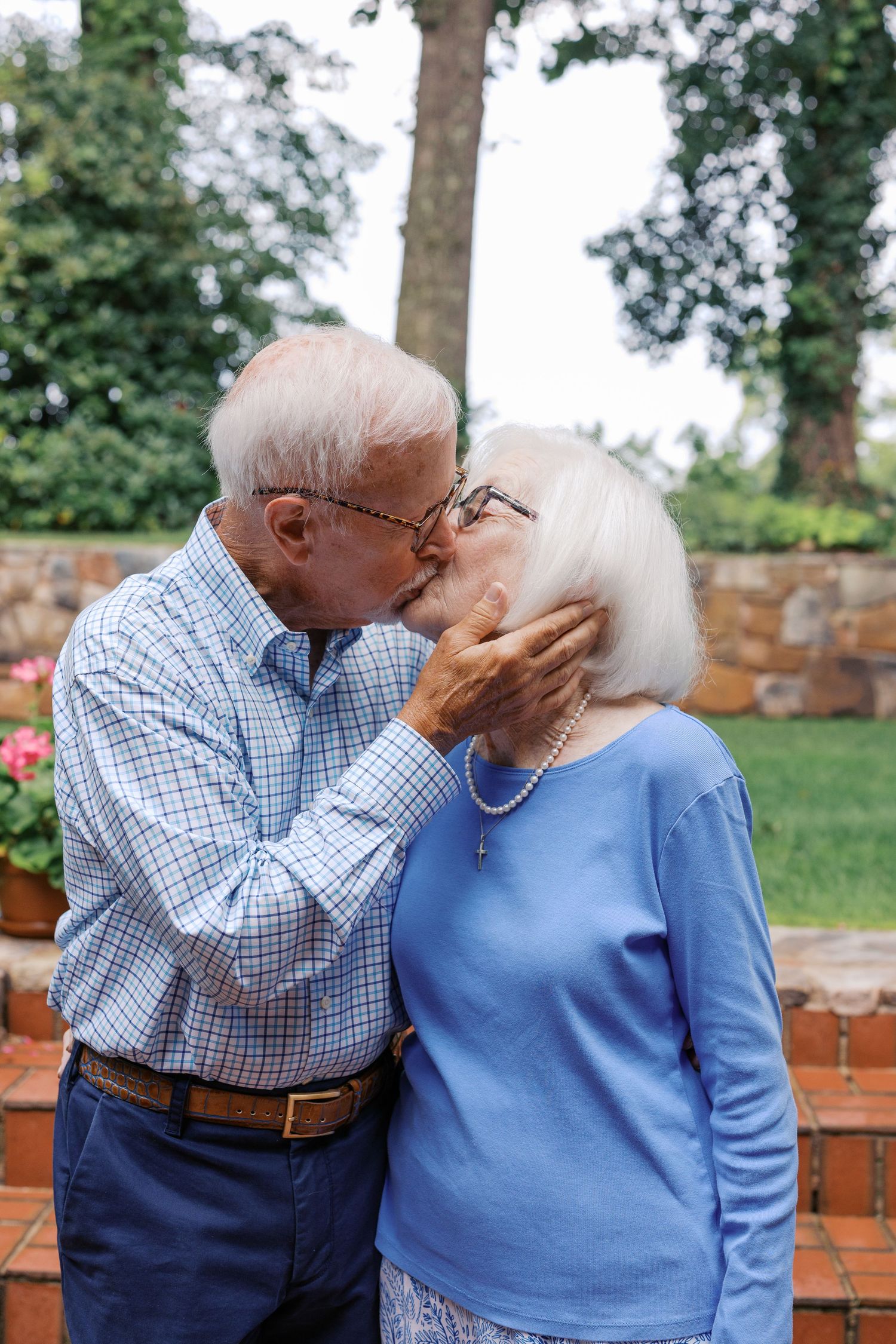 Extended family gathered together for a family reunion in East Tennessee with grandparents, parents, and grandchildren smiling outdoors.