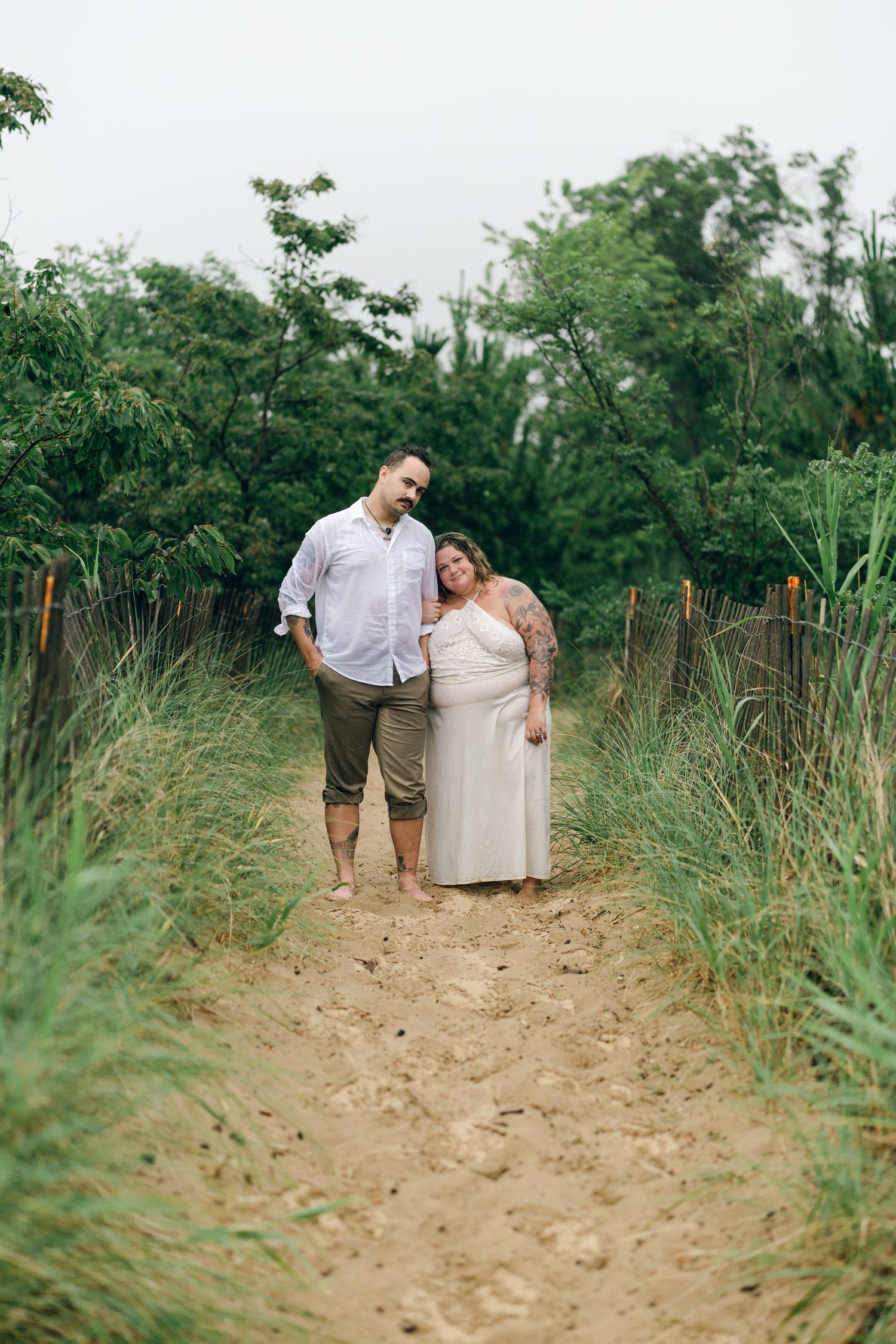 A romantic rainy engagement session at Terrapin Nature Park in Maryland.