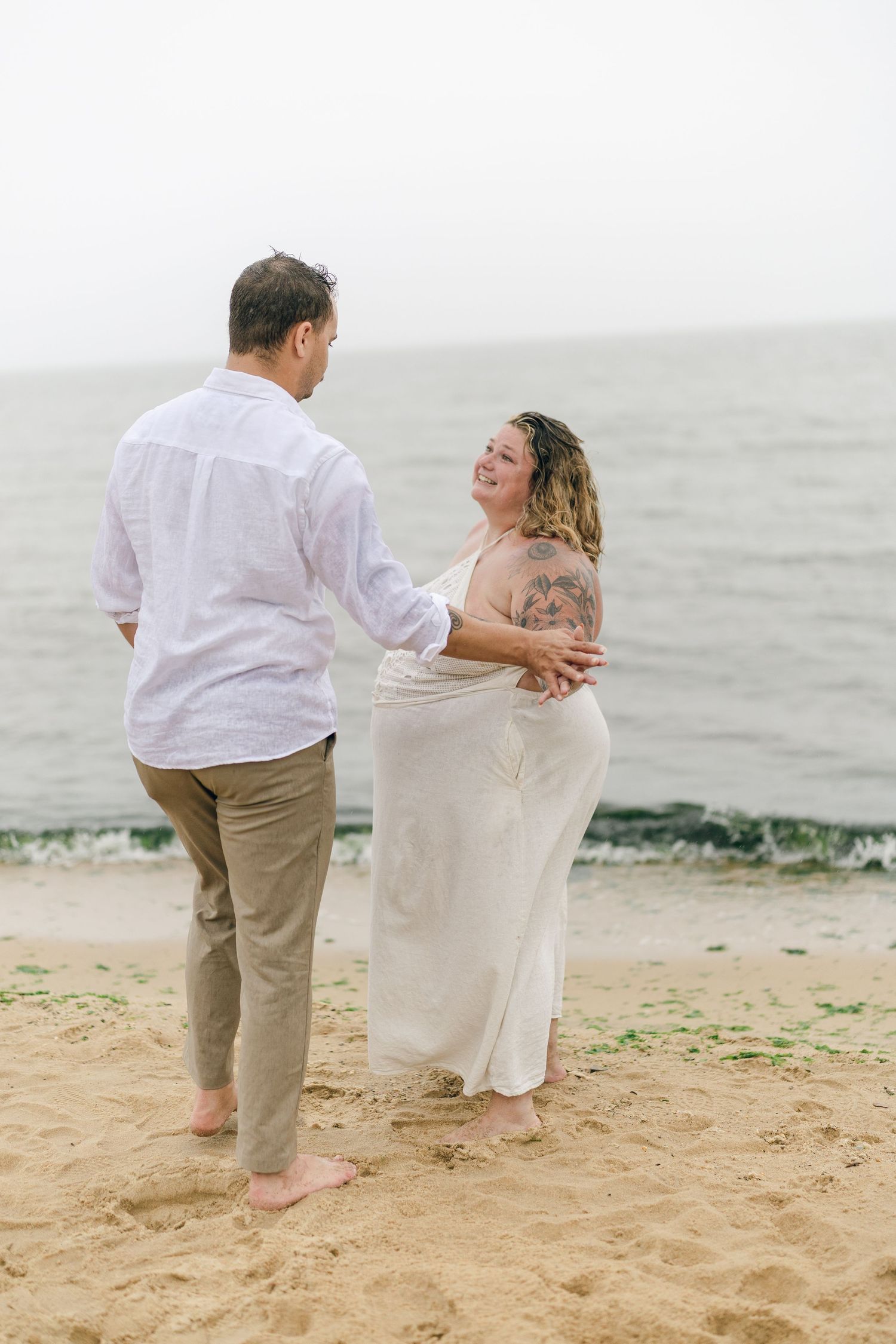 A romantic rainy engagement session at Terrapin Nature Park in Maryland.