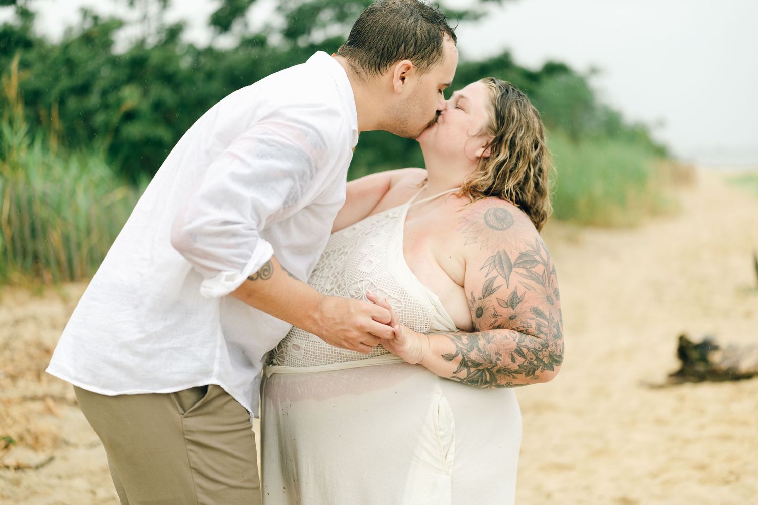 A romantic rainy engagement session at Terrapin Nature Park in Maryland.