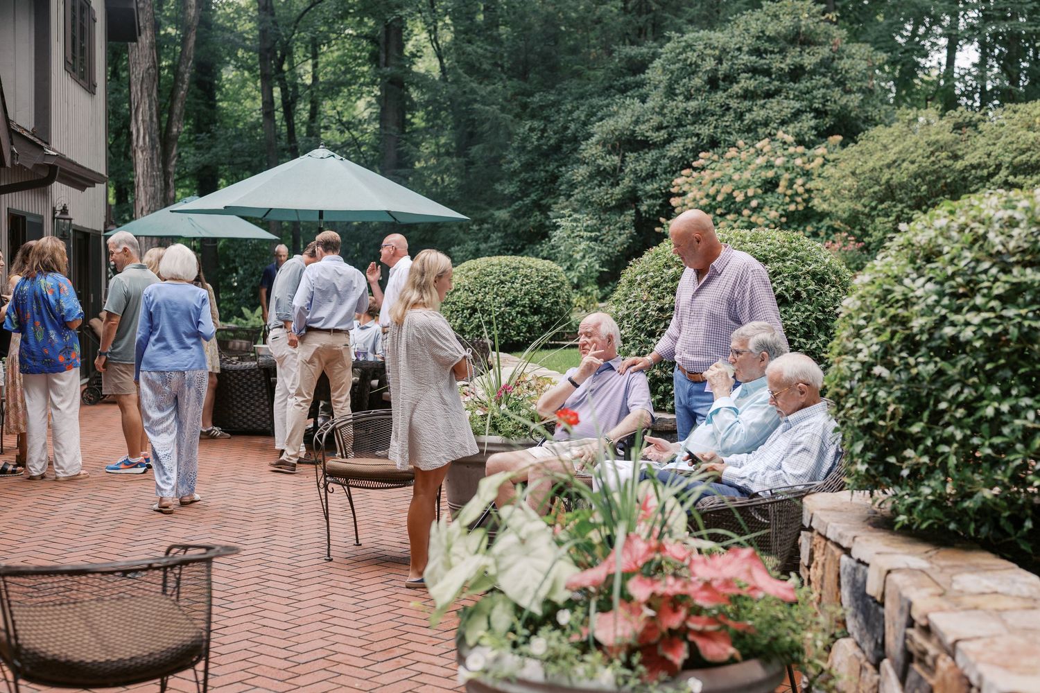 Extended family gathered together for a family reunion in East Tennessee with grandparents, parents, and grandchildren smiling outdoors.