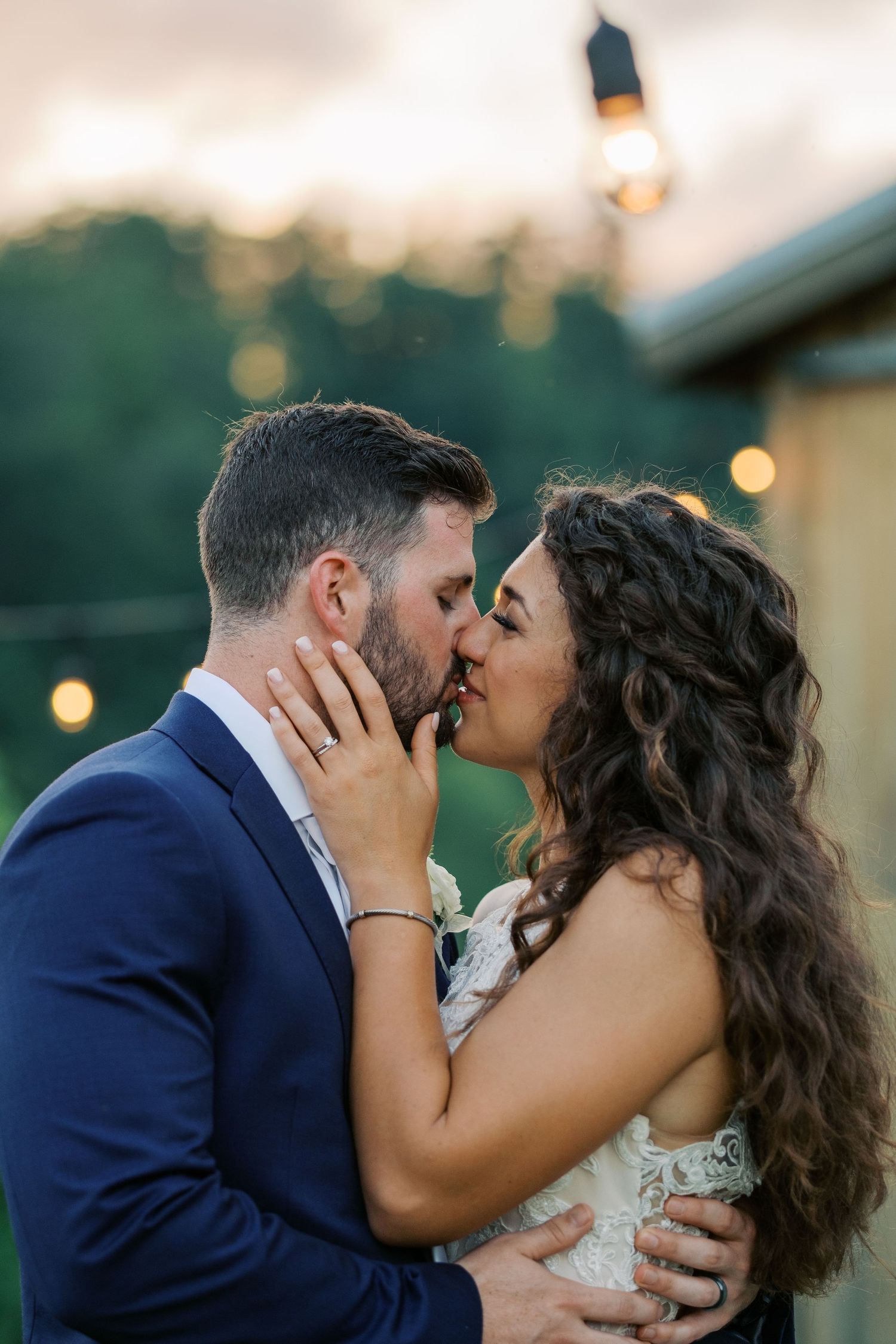 Bride and Groom kissing during golden hour portraits at Mountain Mist Farms wedding in Pigeon Forge, Tennessee