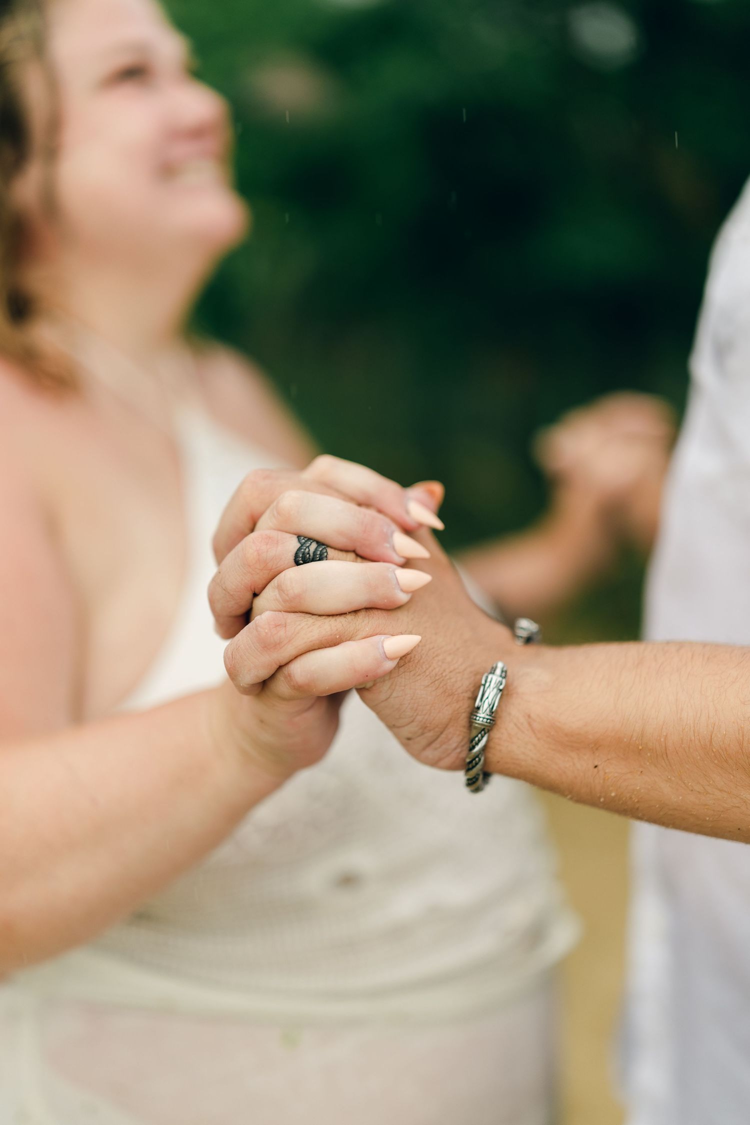 A romantic rainy engagement session at Terrapin Nature Park in Maryland.