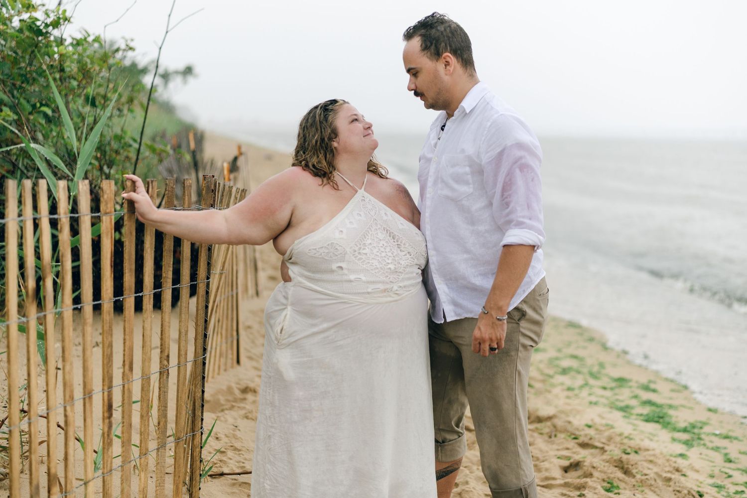 A romantic rainy engagement session at Terrapin Nature Park in Maryland.