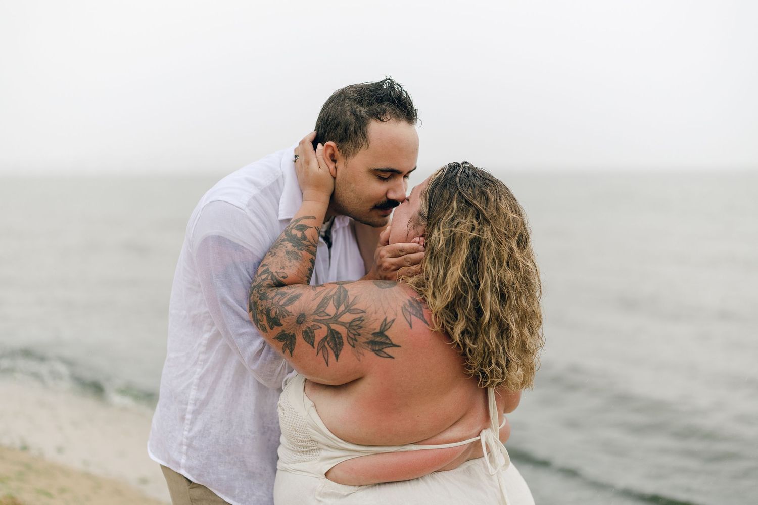 A romantic rainy engagement session at Terrapin Nature Park in Maryland.
