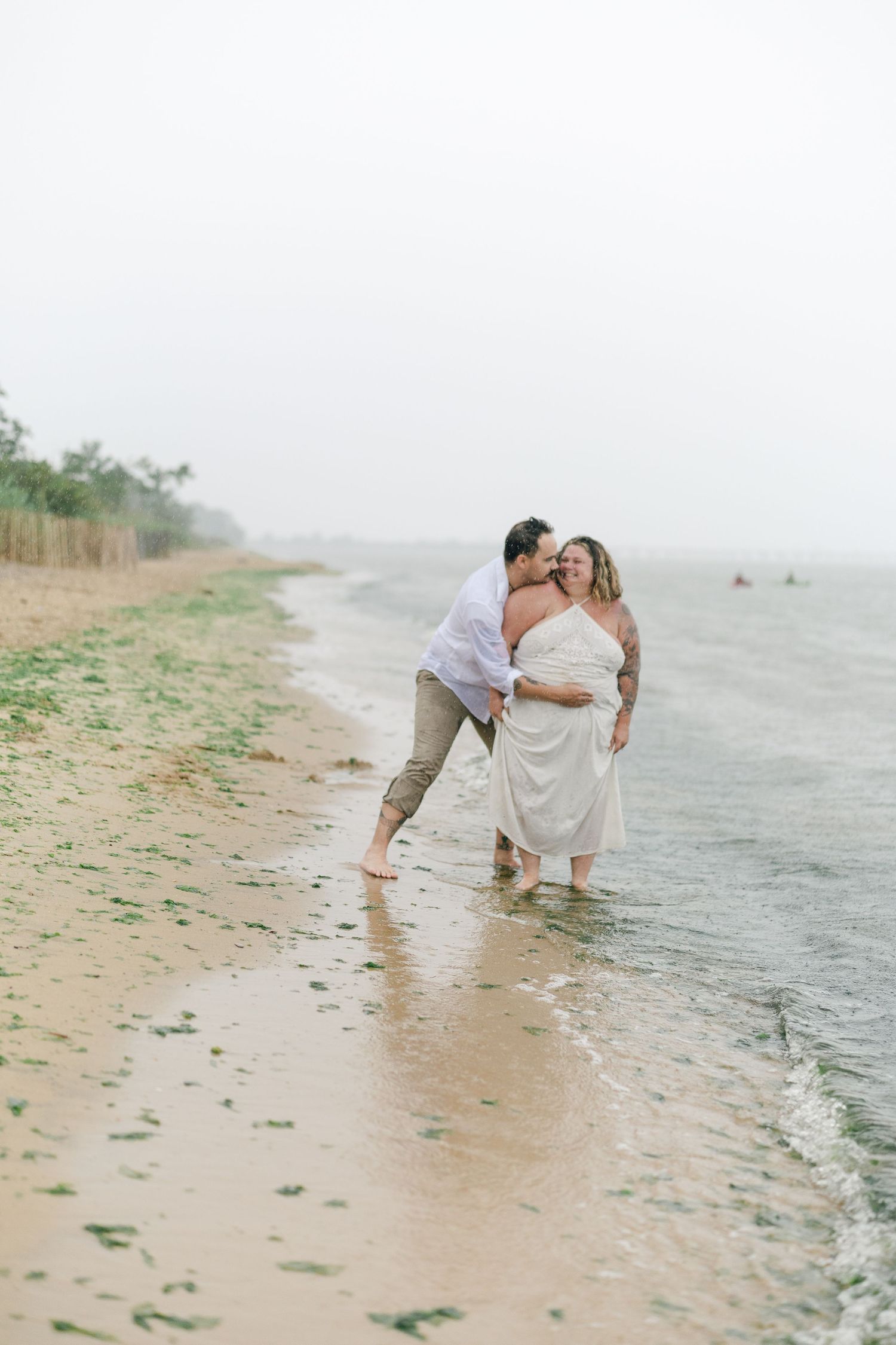 A romantic rainy engagement session at Terrapin Nature Park in Maryland.