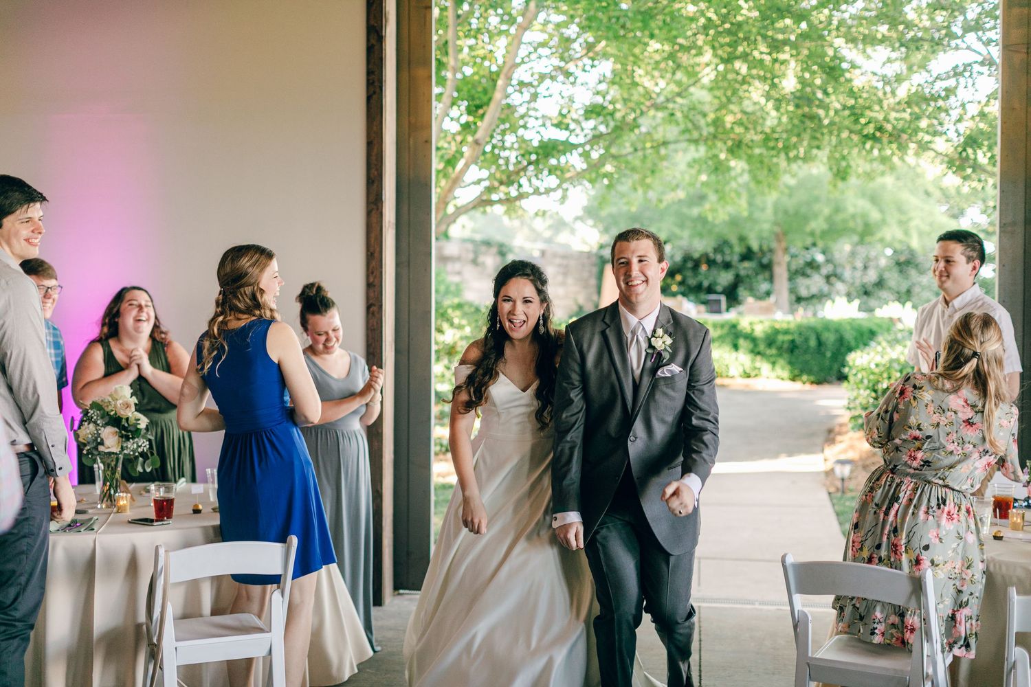 Bride and groom entering reception at Chateau Selah wedding in Tennessee.