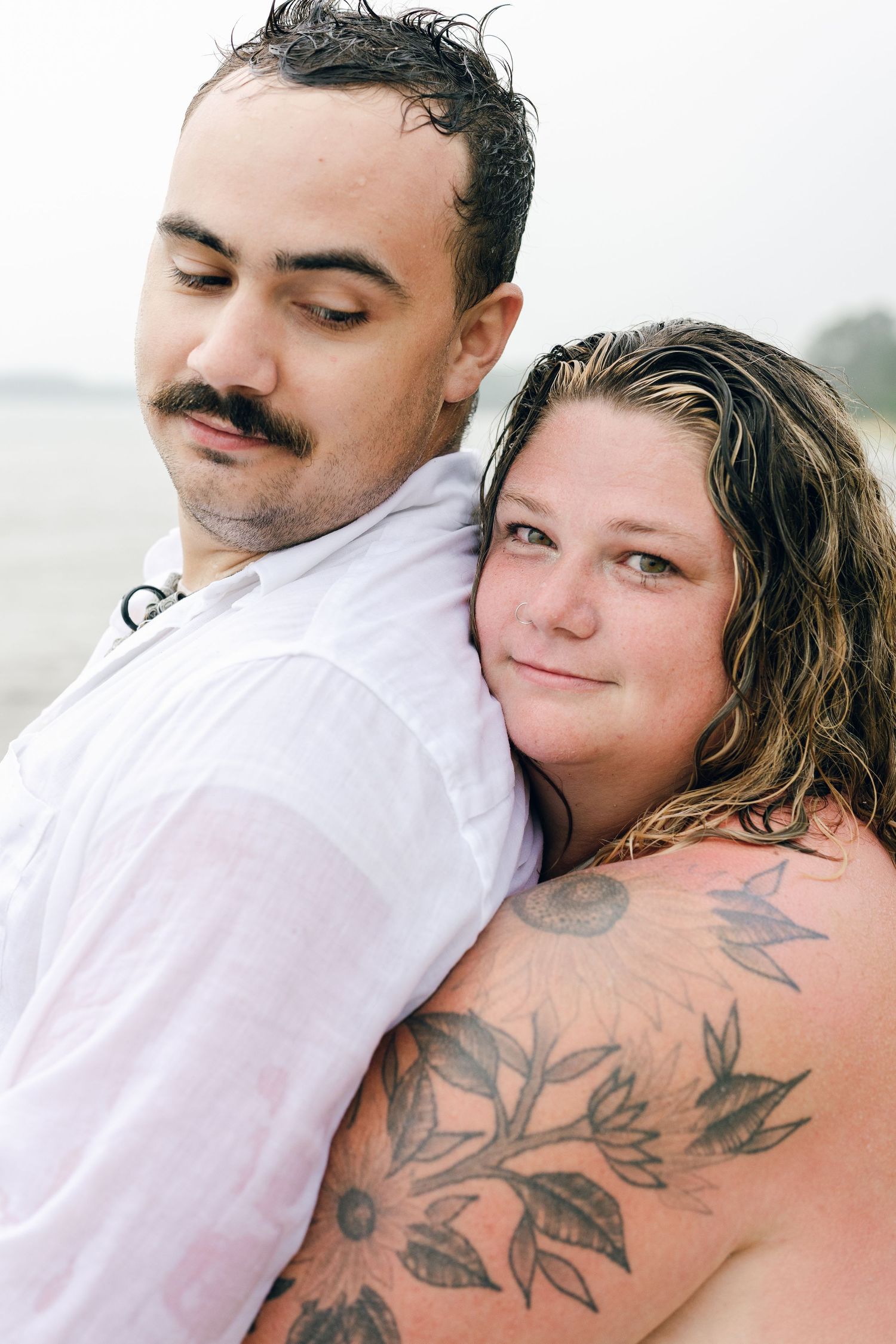A romantic rainy engagement session at Terrapin Nature Park in Maryland.