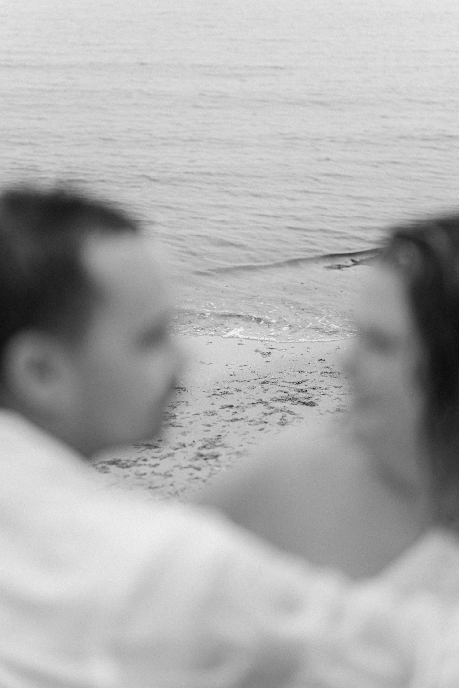 A romantic rainy engagement session at Terrapin Nature Park in Maryland.
