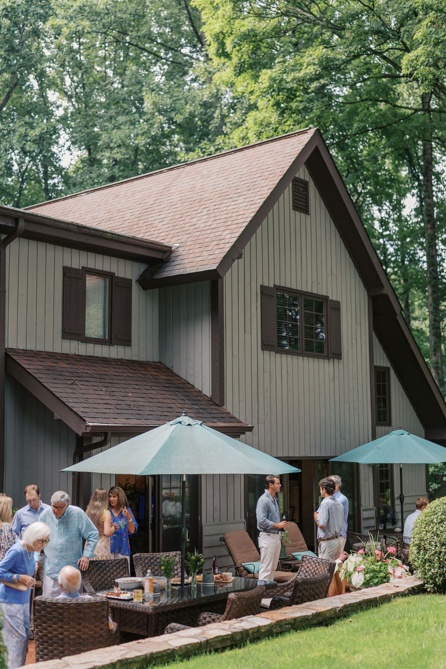 Extended family gathered together for a family reunion in East Tennessee with grandparents, parents, and grandchildren smiling outdoors.