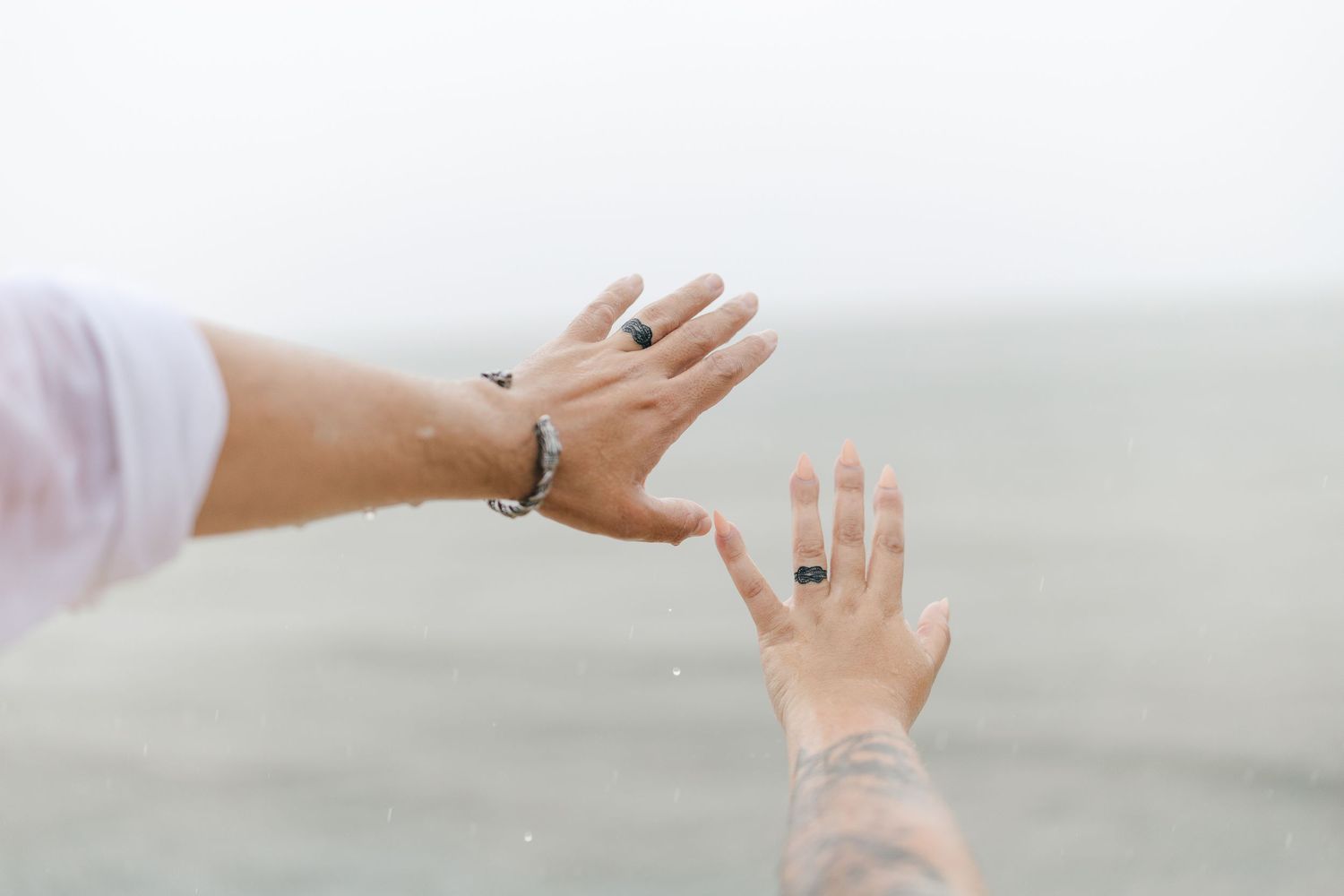 A romantic rainy engagement session at Terrapin Nature Park in Maryland.