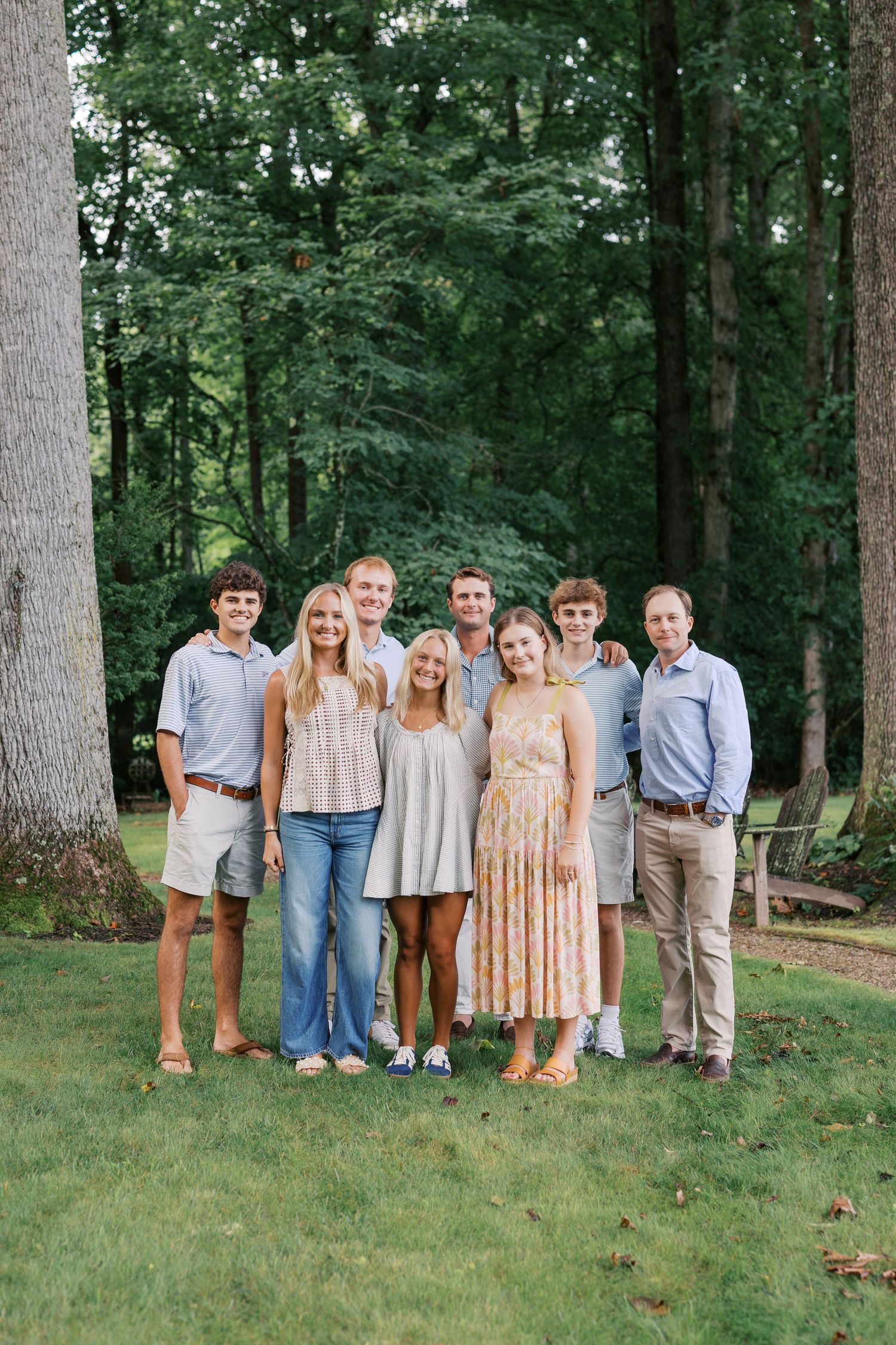 Extended family gathered together for a family reunion in East Tennessee with grandparents, parents, and grandchildren smiling outdoors.