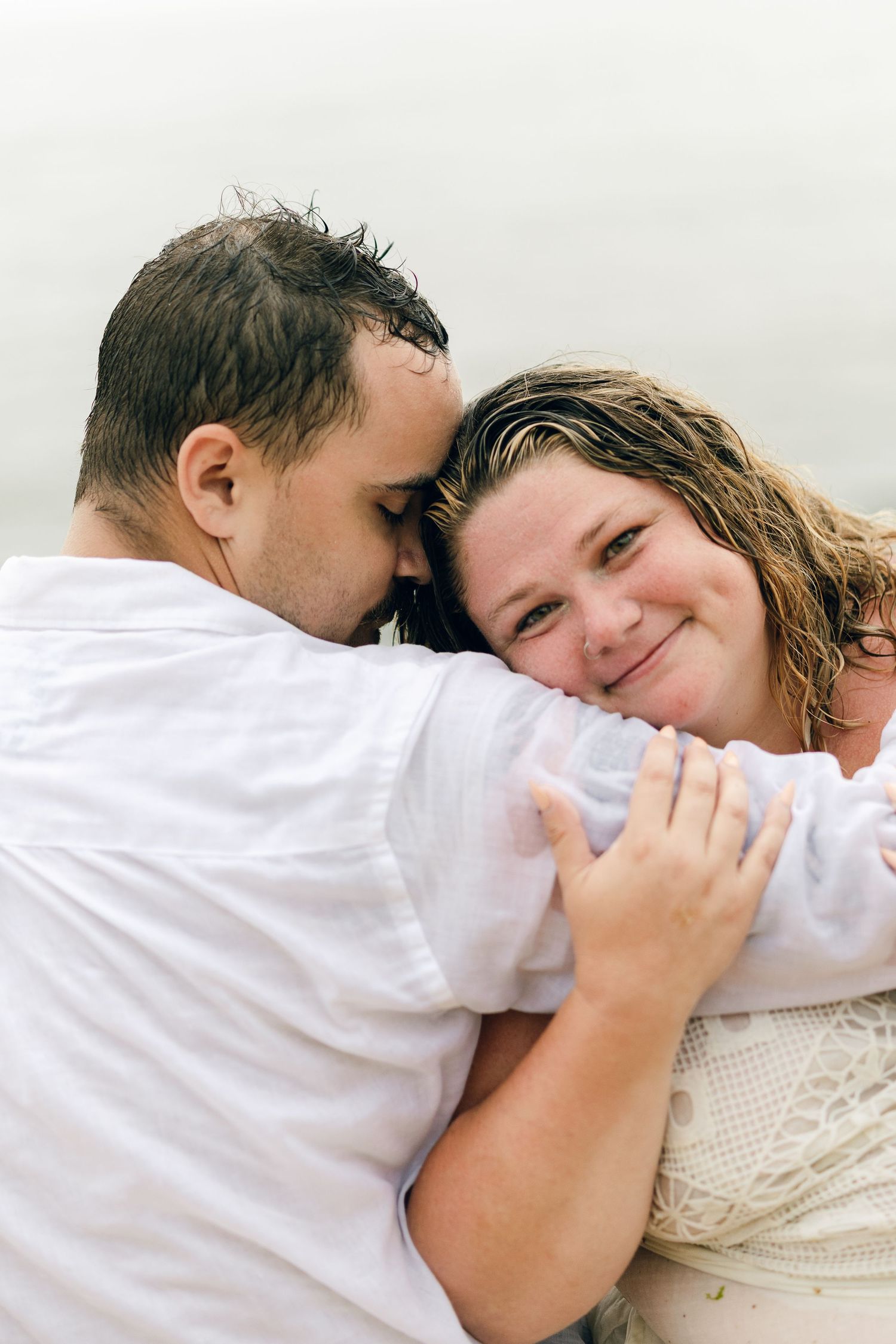 A romantic rainy engagement session at Terrapin Nature Park in Maryland.