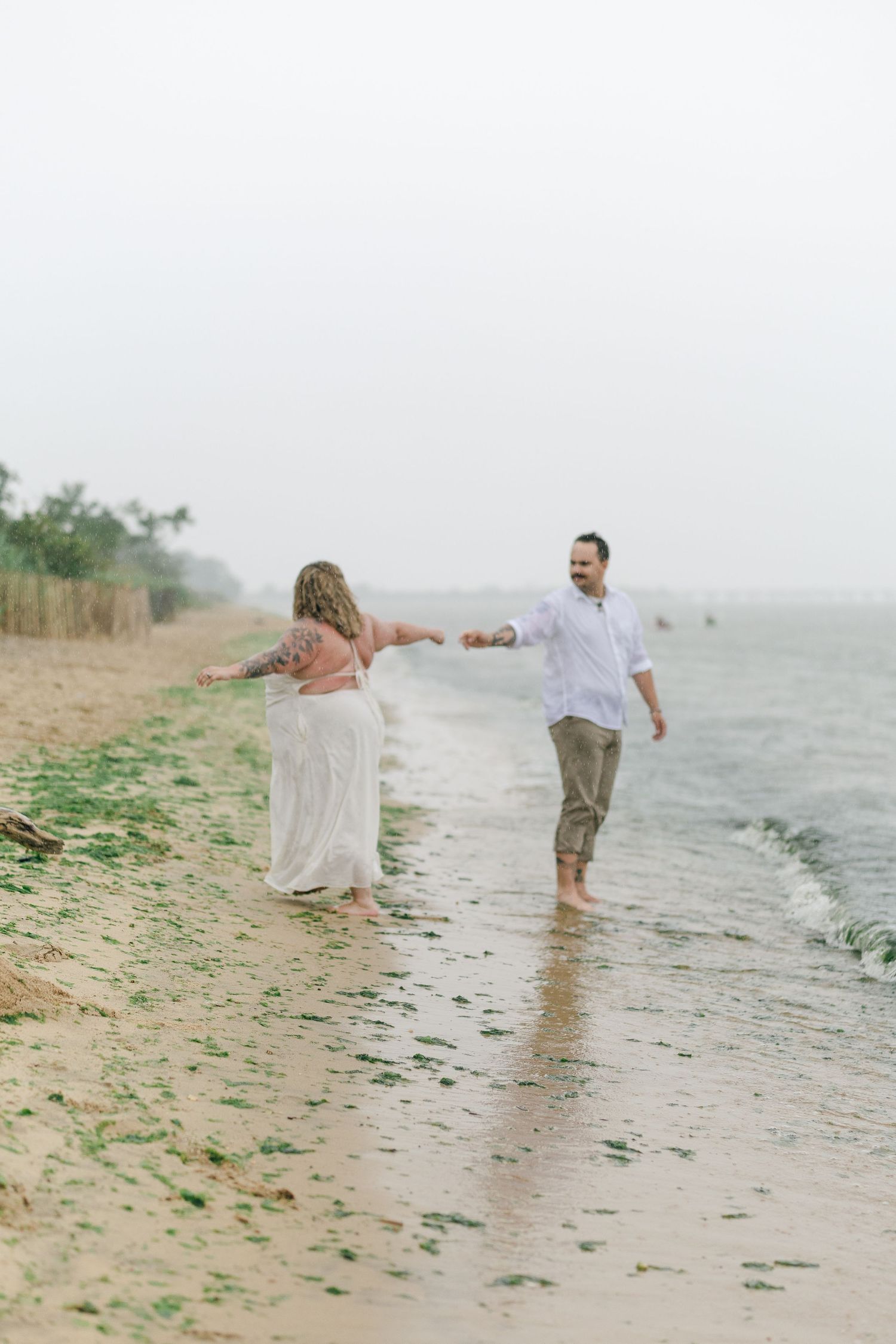 A romantic rainy engagement session at Terrapin Nature Park in Maryland.
