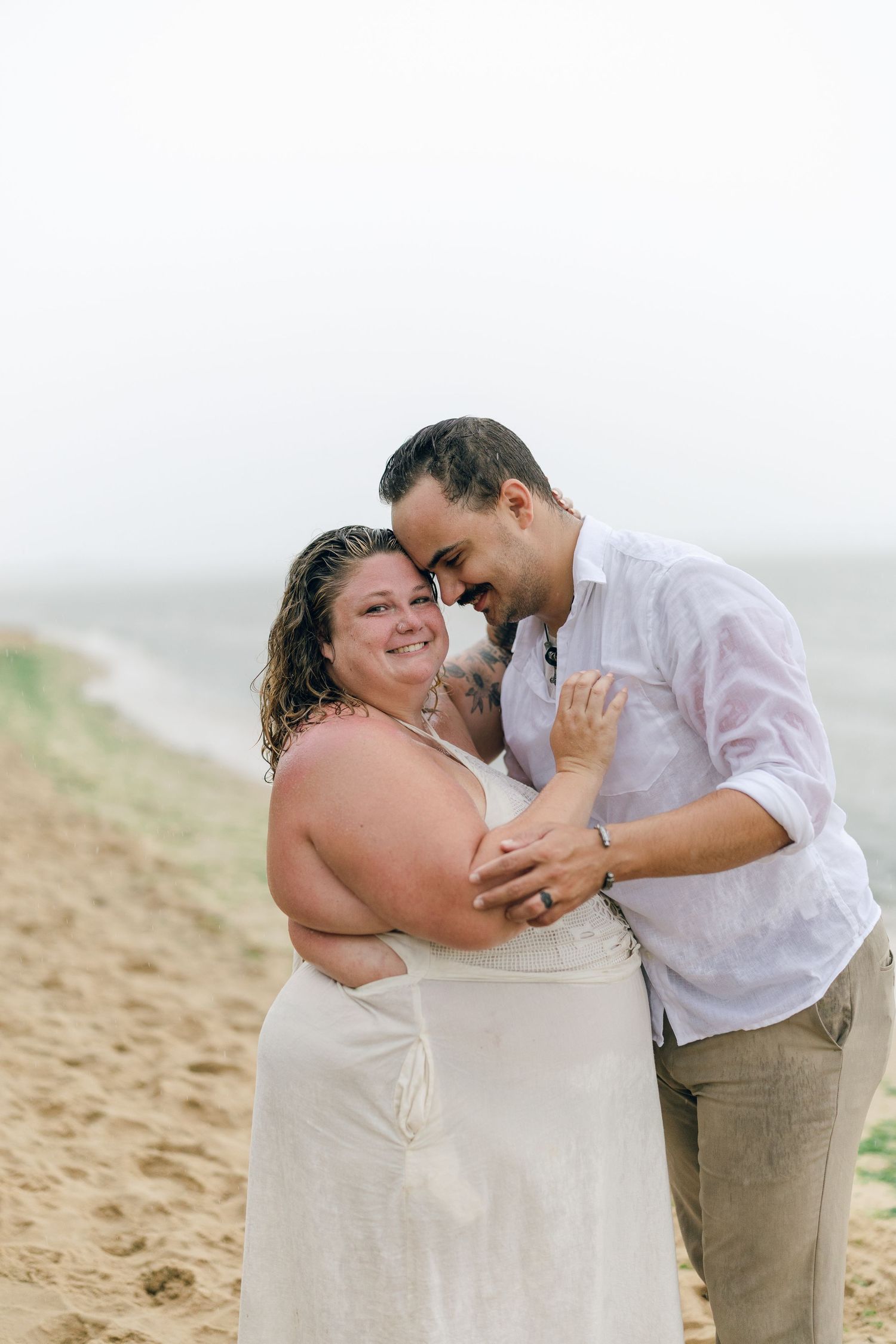 A romantic rainy engagement session at Terrapin Nature Park in Maryland.