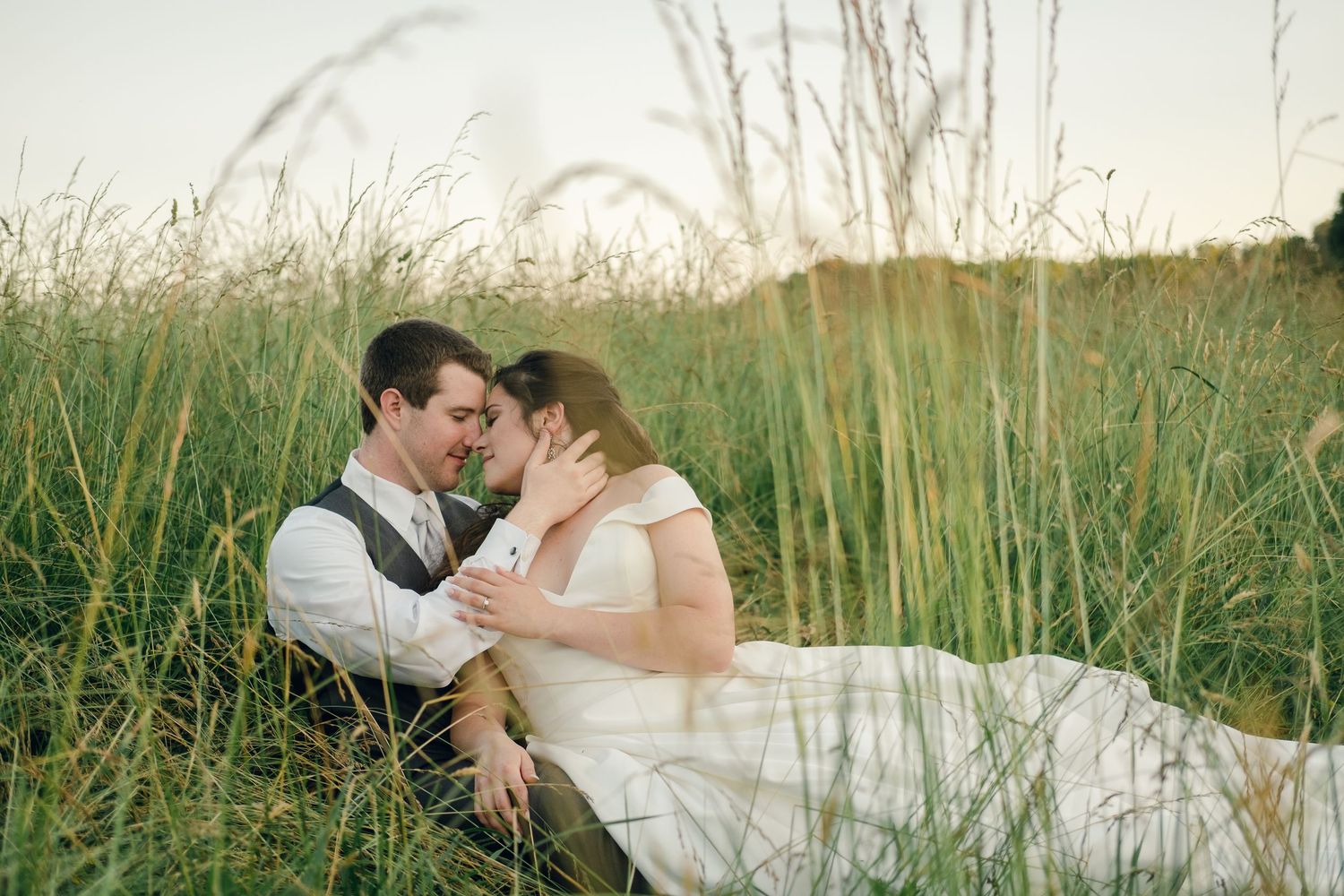 Bride and groom portraits during golden hour in a field at Chateau Selah wedding in Tennessee.