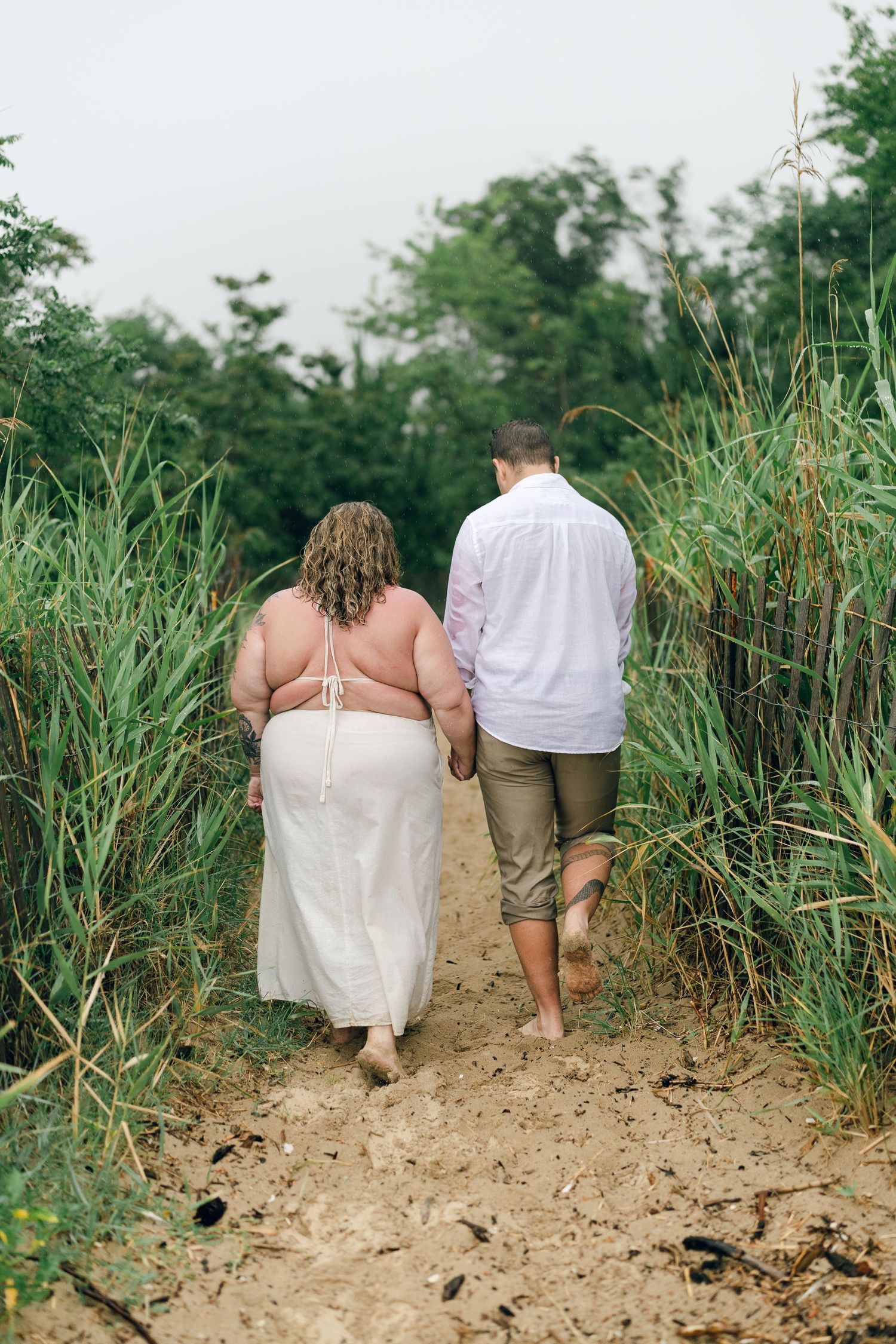 A romantic rainy engagement session at Terrapin Nature Park in Maryland.
