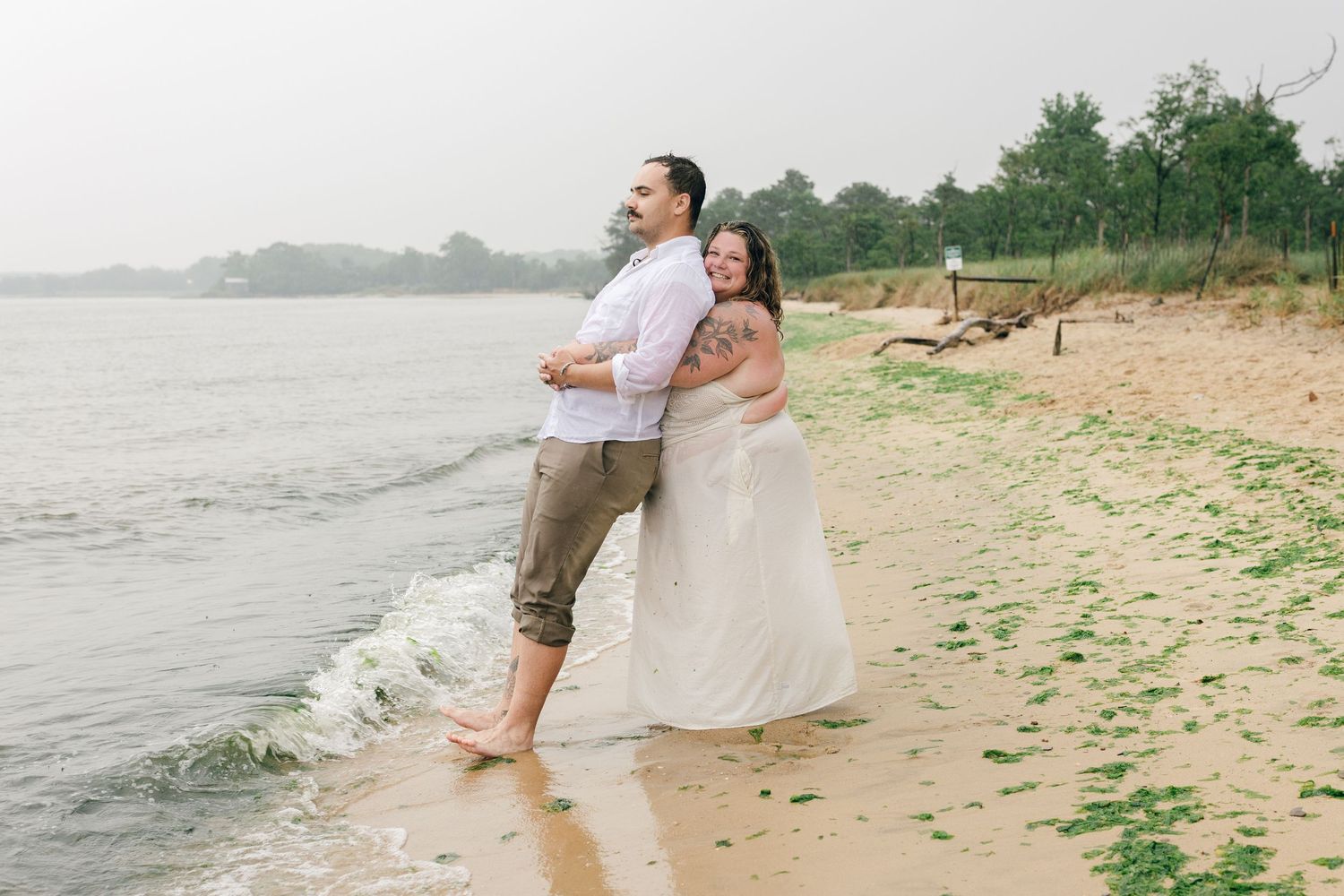 A romantic rainy engagement session at Terrapin Nature Park in Maryland.