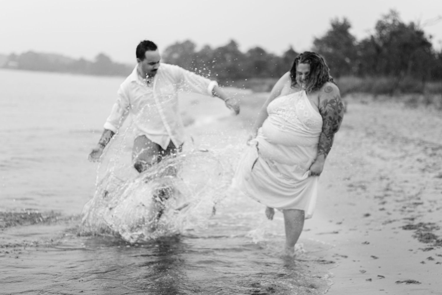 A romantic rainy engagement session at Terrapin Nature Park in Maryland.