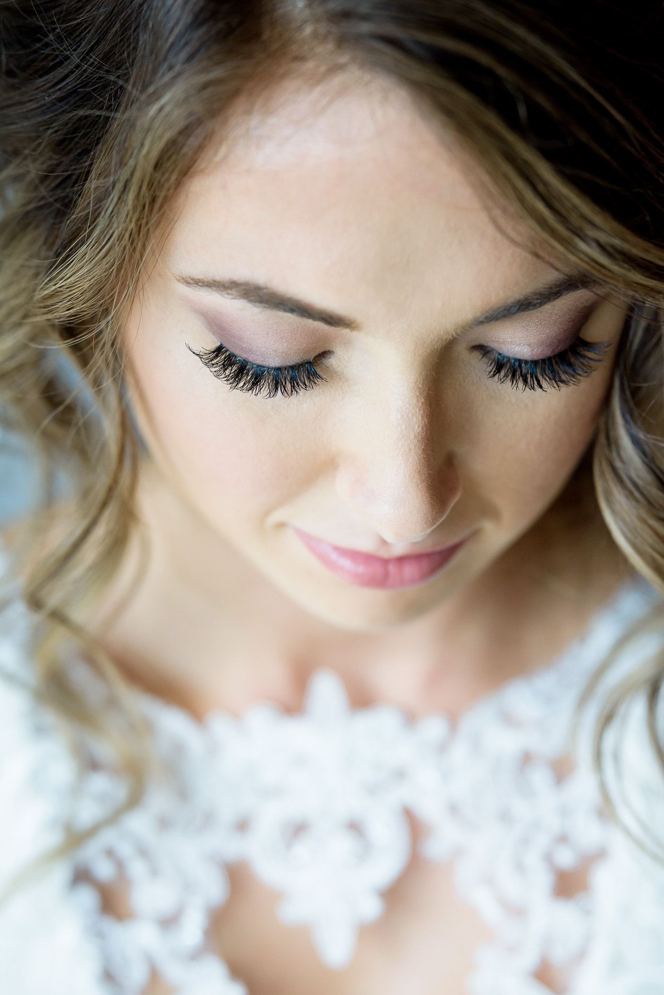 Close-up beauty shot of delicate bridal makeup and lashes.