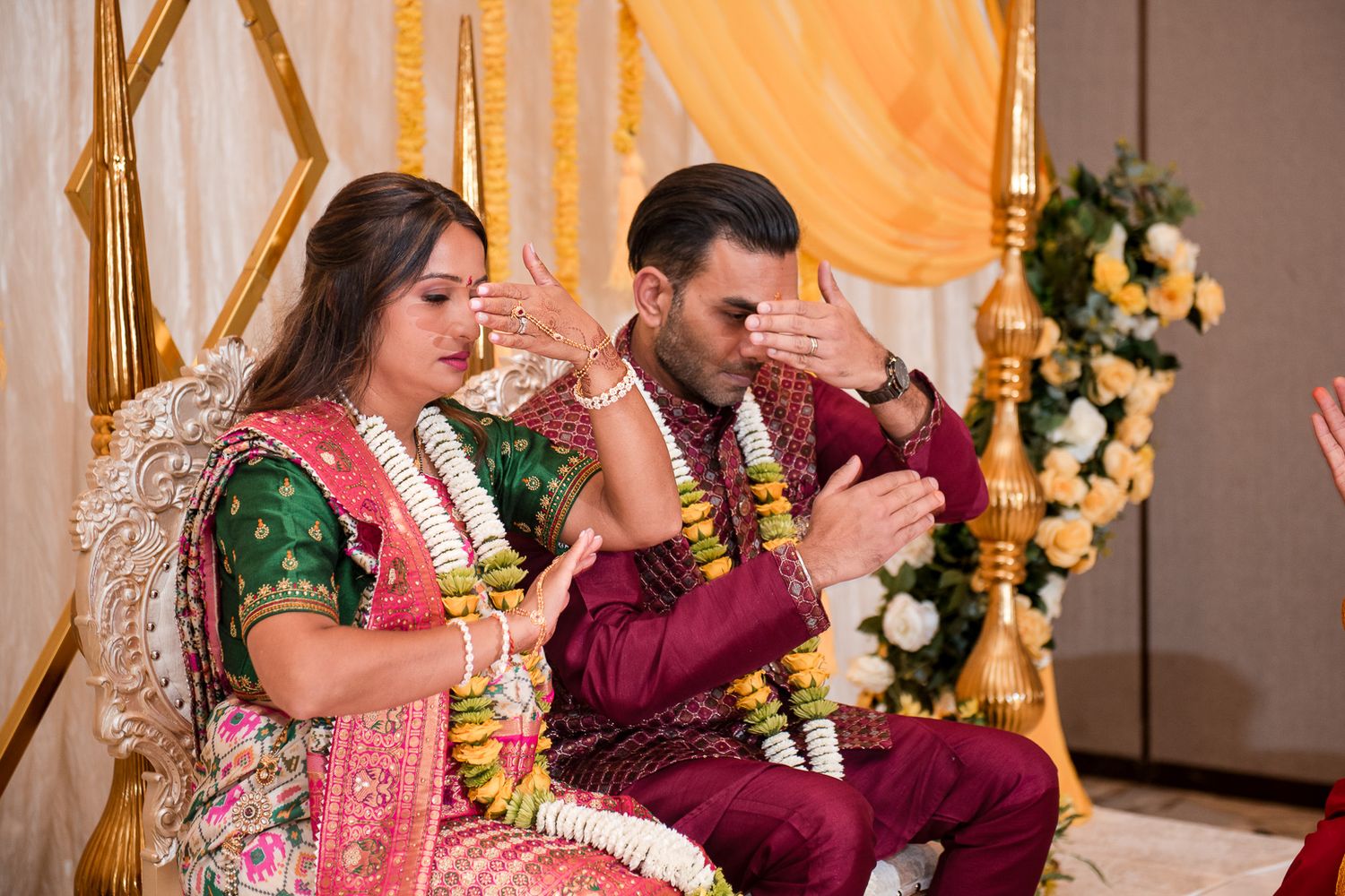 Cultural wedding ceremony with participants dressed in vibrant traditional attire.