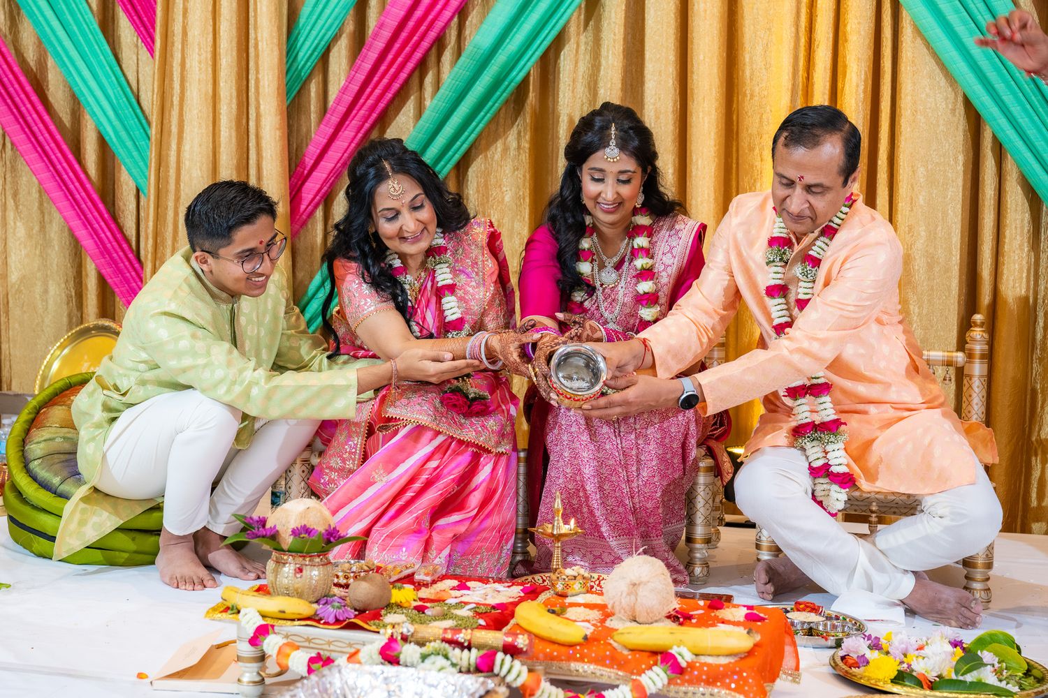 Traditional Indian pre-wedding ritual showing family members performing ceremonial customs.