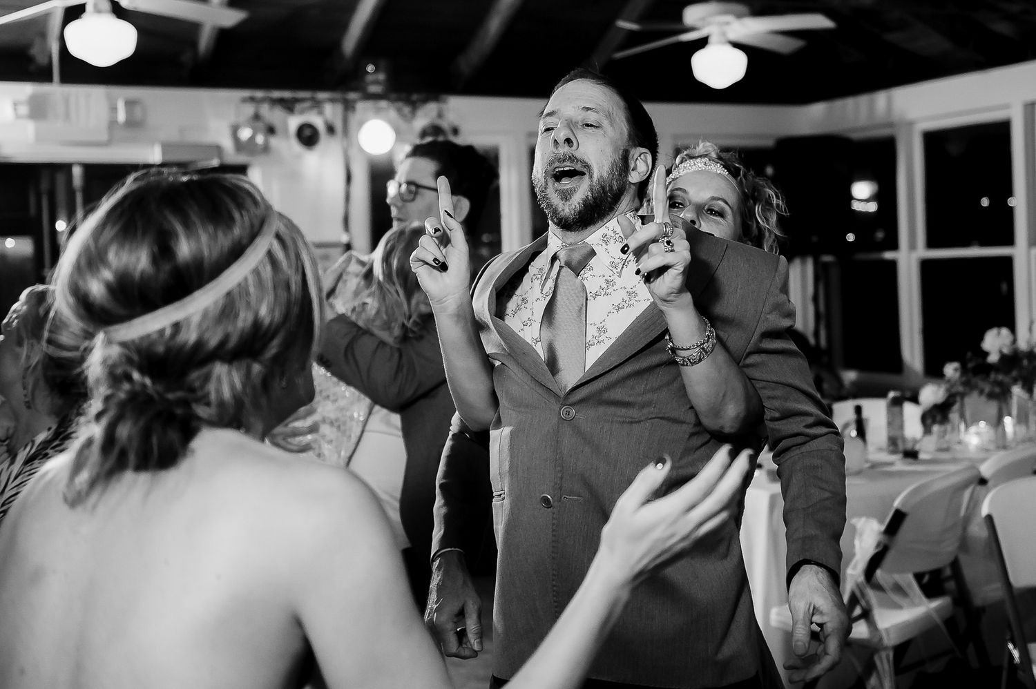 Joyful celebration moment captured during wedding reception.