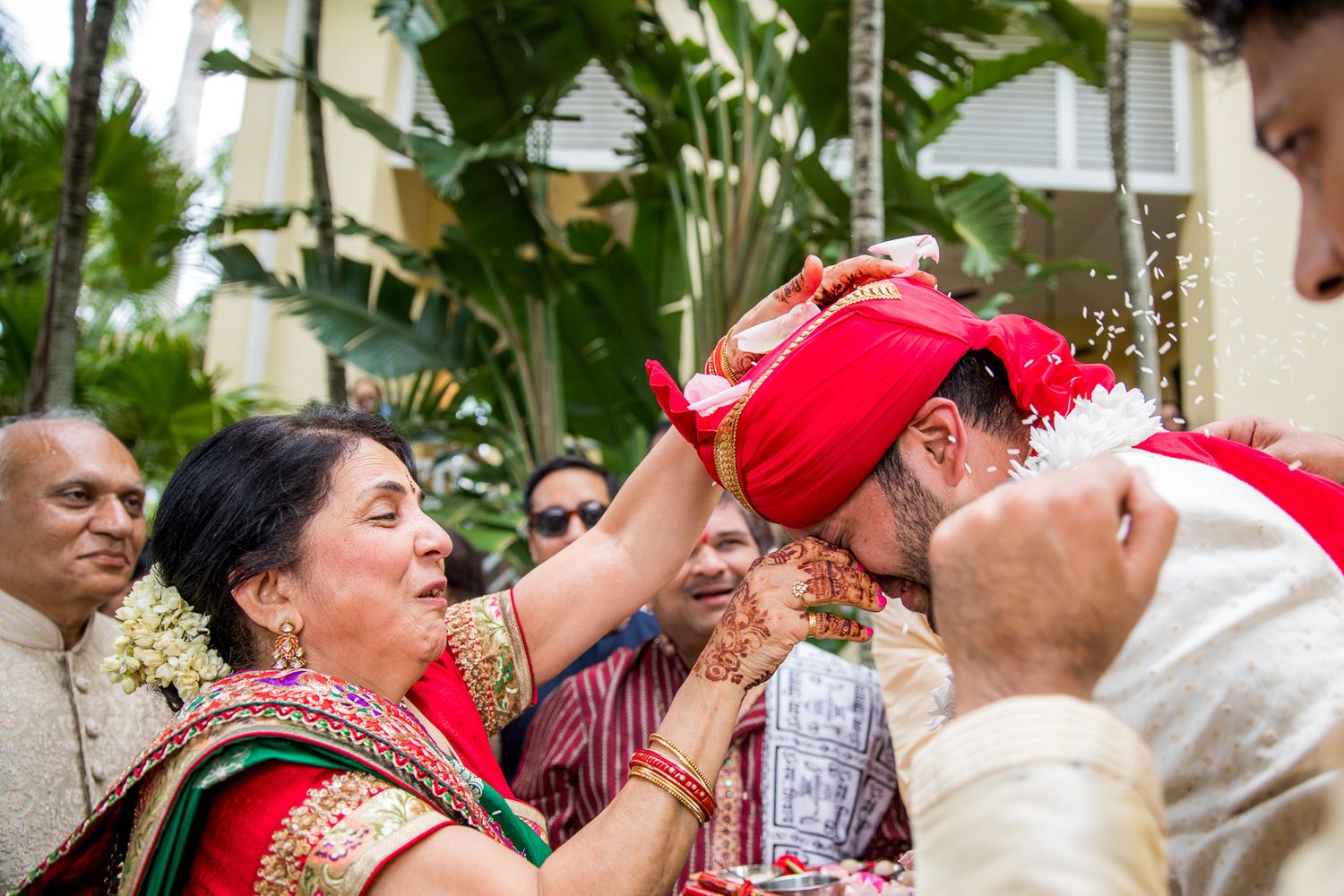 Festive celebration showing traditional Indian wedding customs with guests participating in vibrant ceremonies.