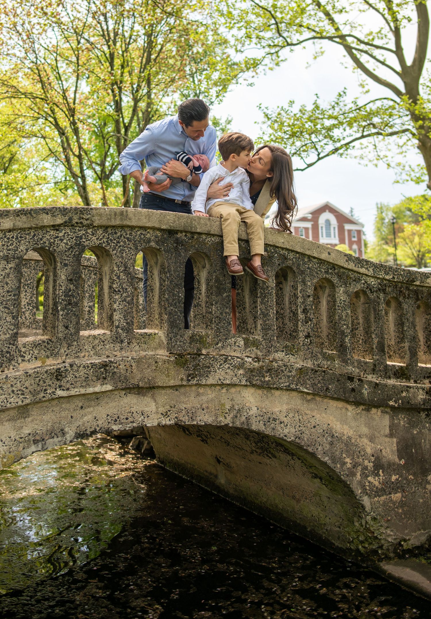 A stone bridge arch photographed from different angles in a park setting with autumn trees.