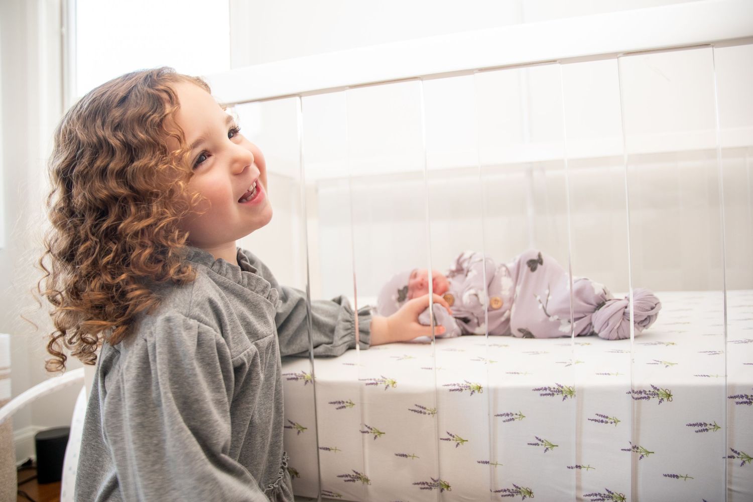 Child playing near bright window with natural light streaming in.