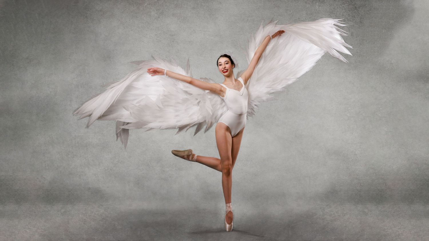 Contemporary dance photography with a young ballet dancer with white wings