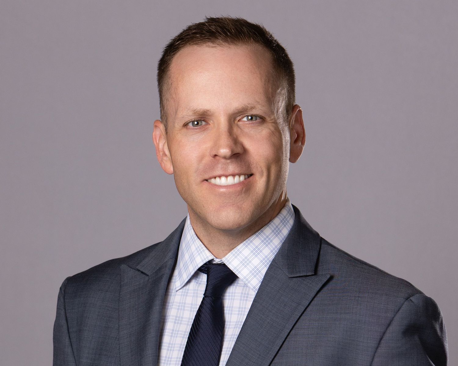 Professional business headshot of executive in Phoenix studio
