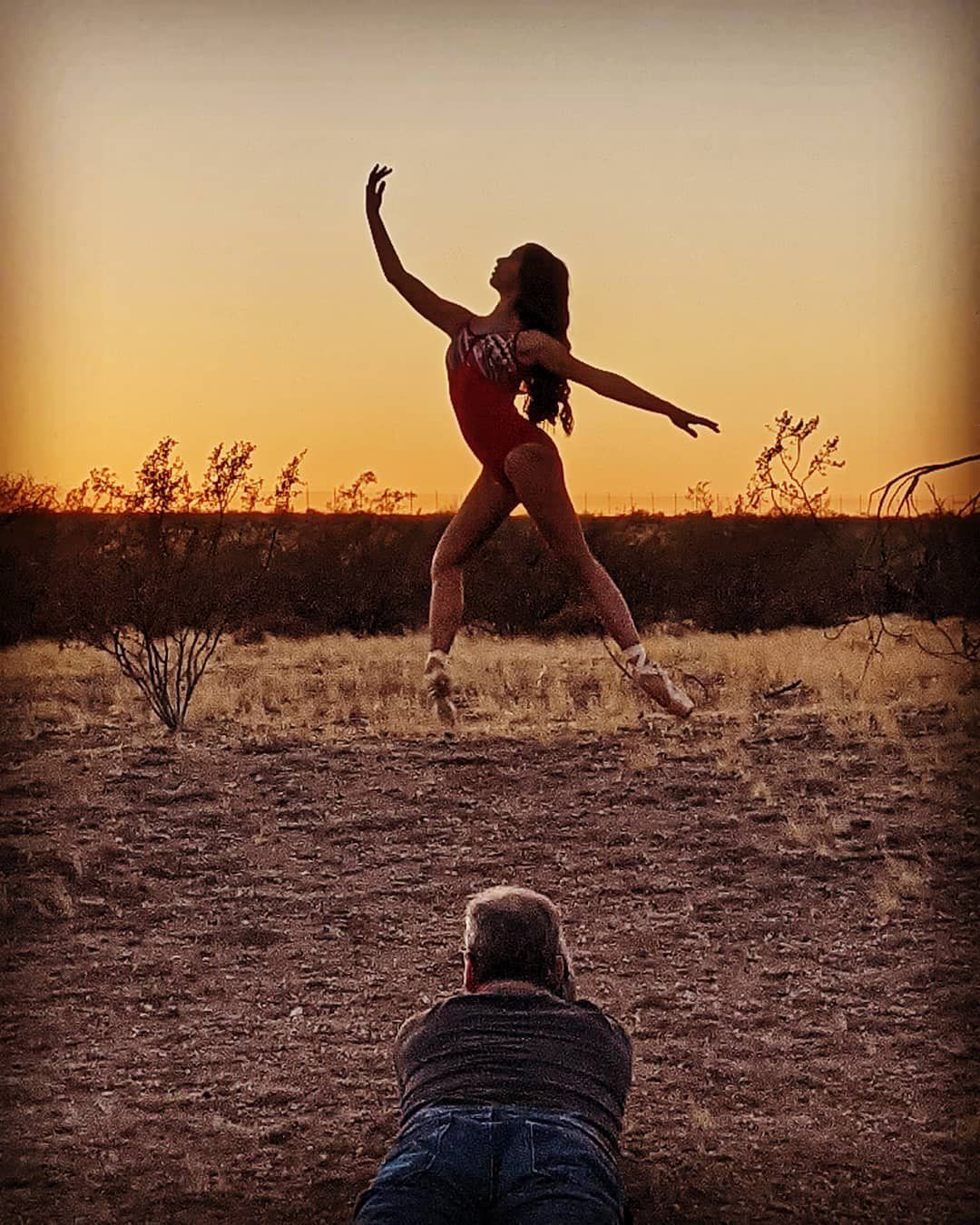 BTS shot of Tom photographing a ballet dancer in the desert at sunset
