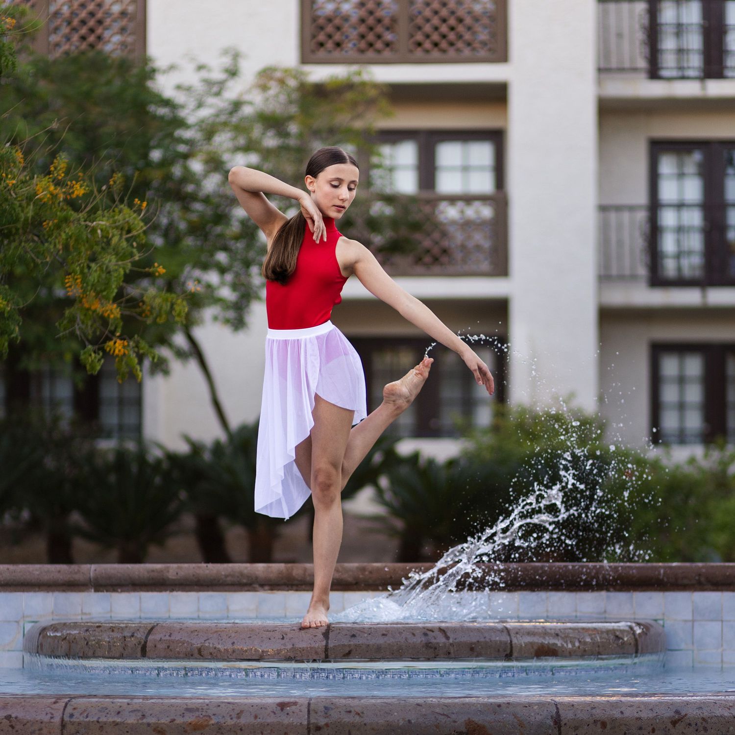 Outdoor dance photography of a dancer in a fountain