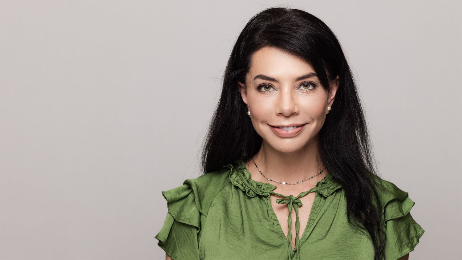 Professional headshot with clean background
