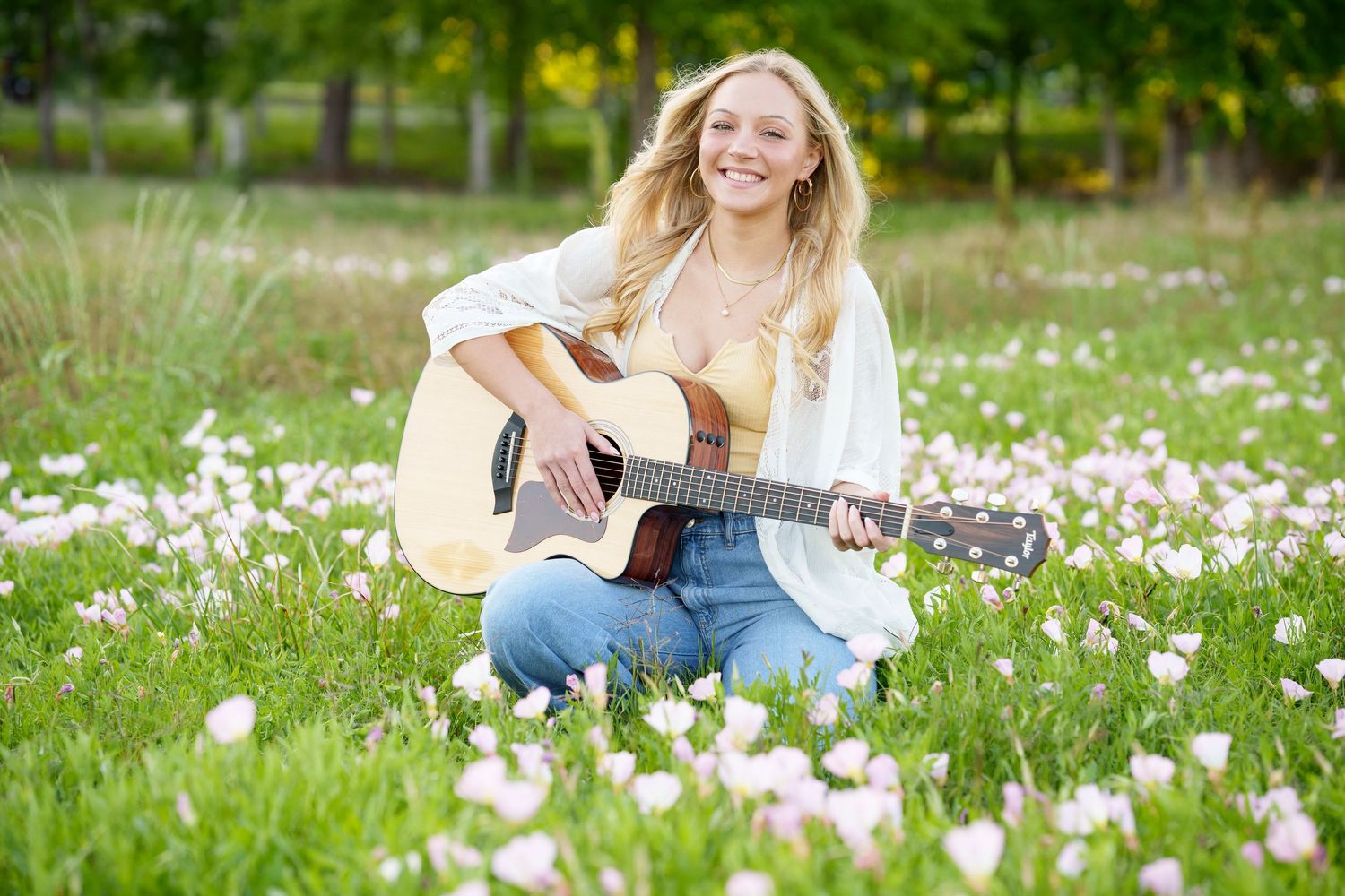 The Woodlands senior photographer.  Senior photos with a guitar.  Girl in a flower field