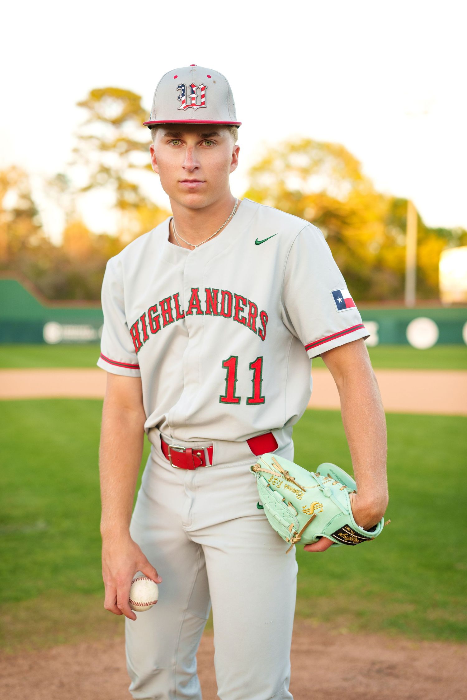 senior photos on a baseball field.  pitcher baseball photos in the woodlands.