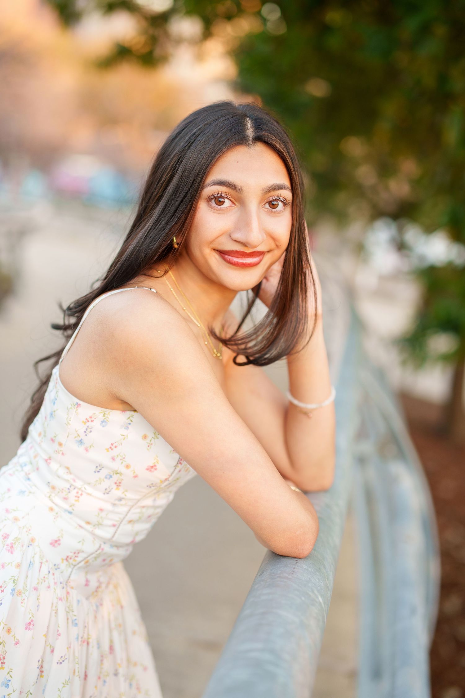 houston senior photos on a walkway bridge.  the woodlands senior photographer with a girl in a long dress