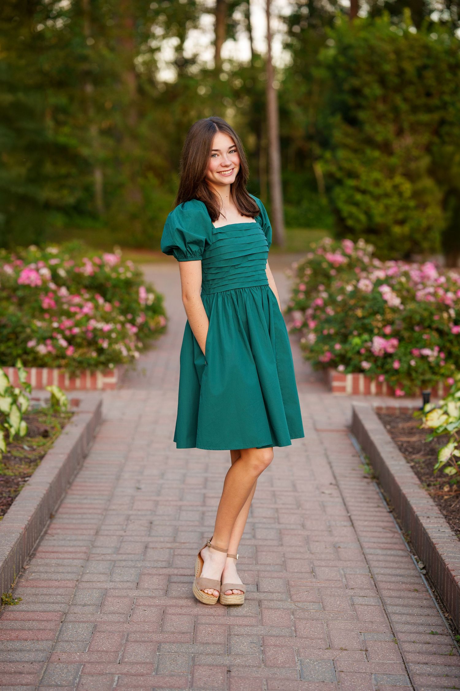 senior girl in a garden of flowers
