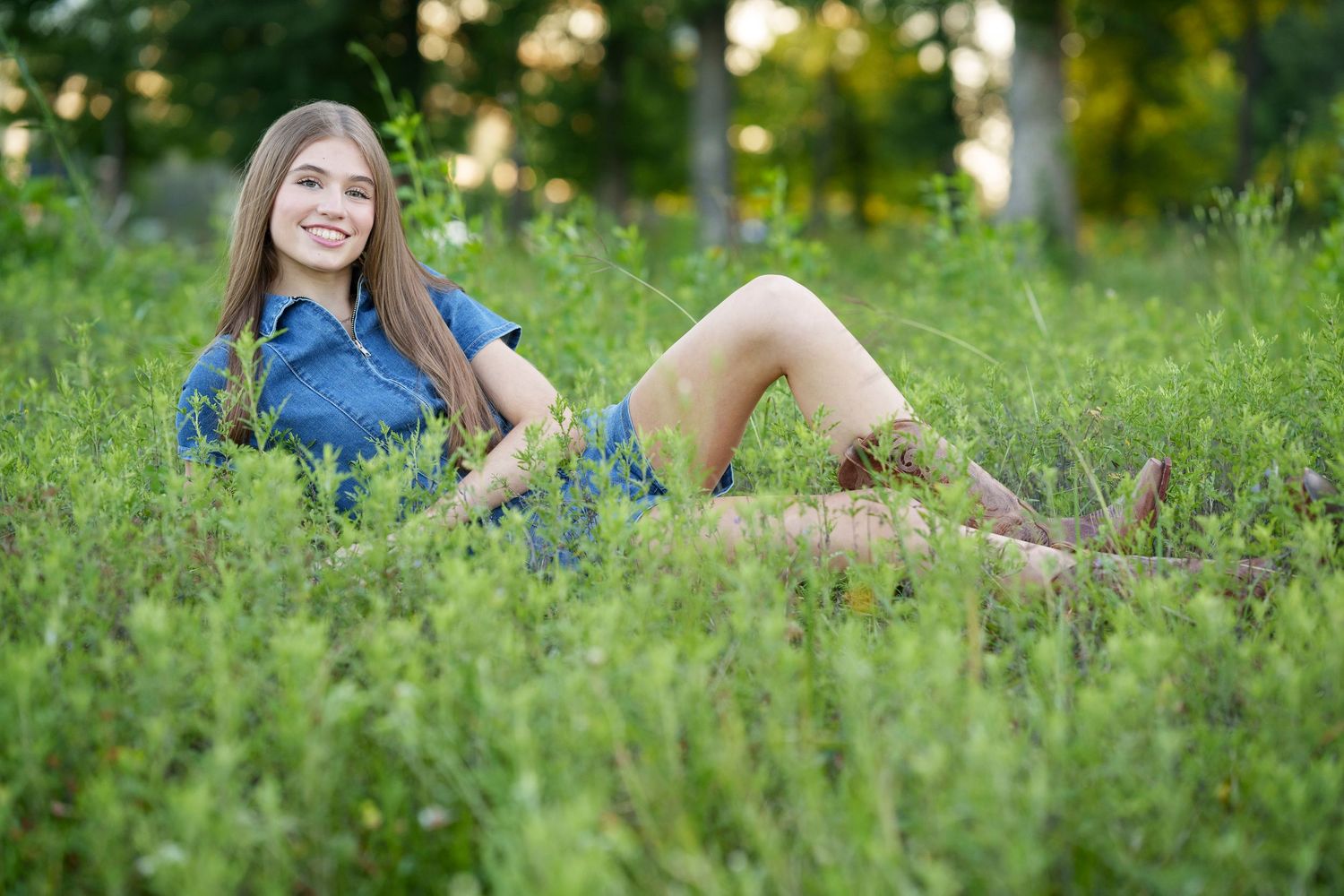 The Woodlands senior photographer.  Senior girl in tall grass in a field